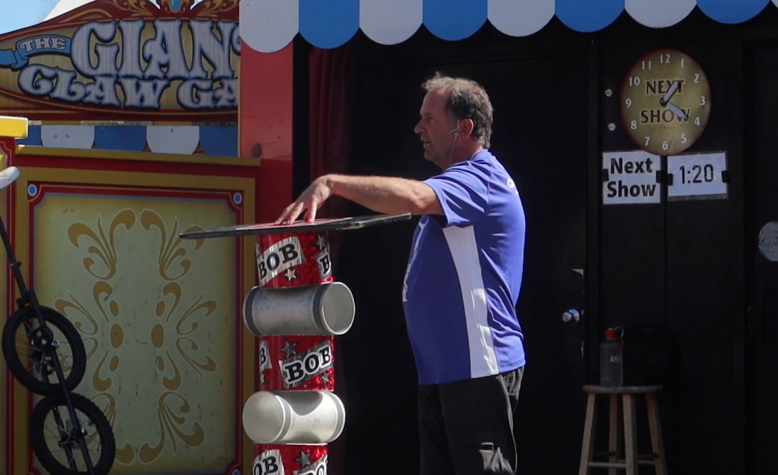 Bob At Large Pier 39 San Francisco street show, Bob At Large balancing props during his famous comedy performance at the iconic Pier 39 waterfront