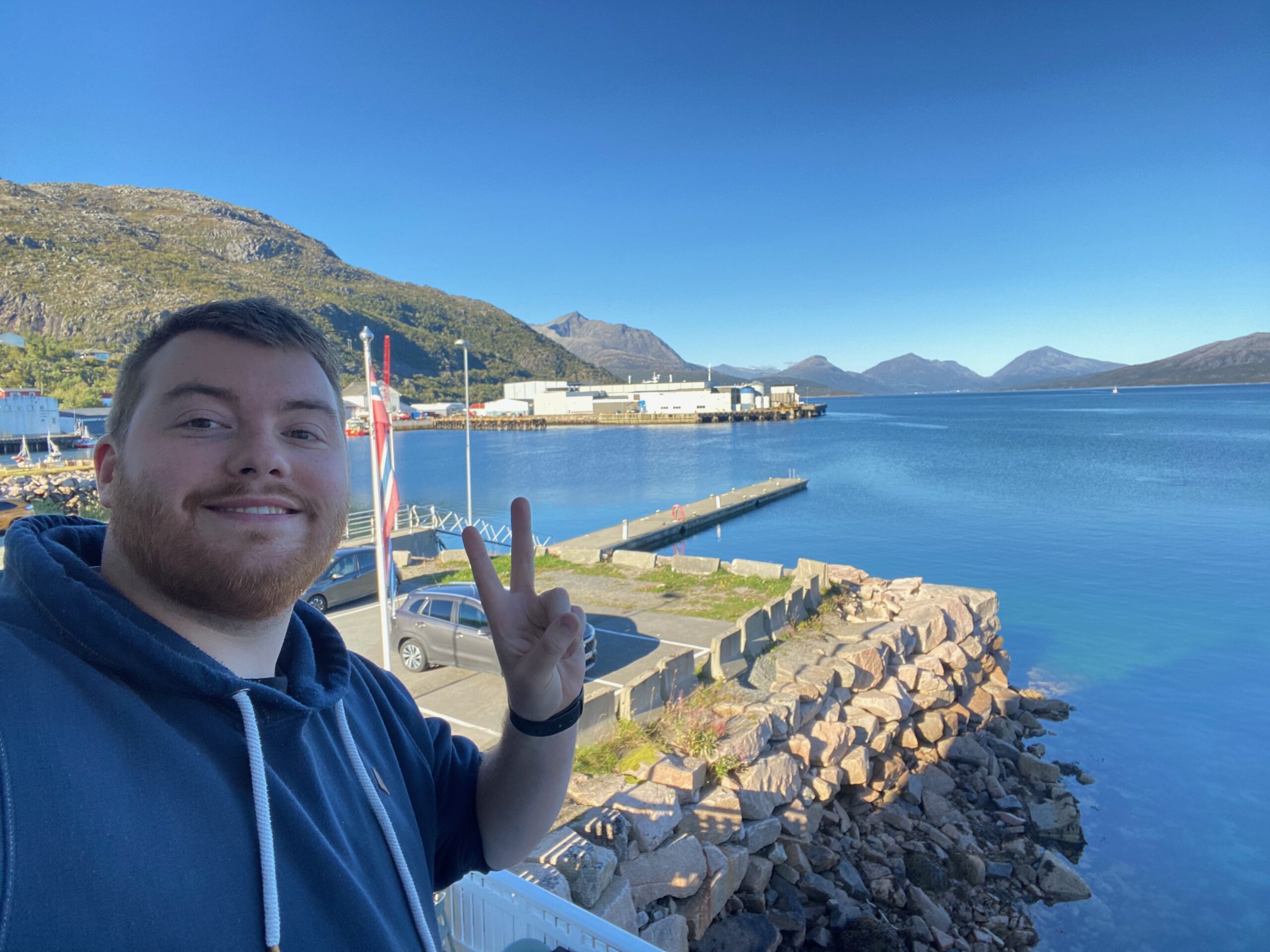 View from Lødingen Brygge Hotel Norway with fjord, harbor, mountains and clear blue water in Northern Norway during daytime