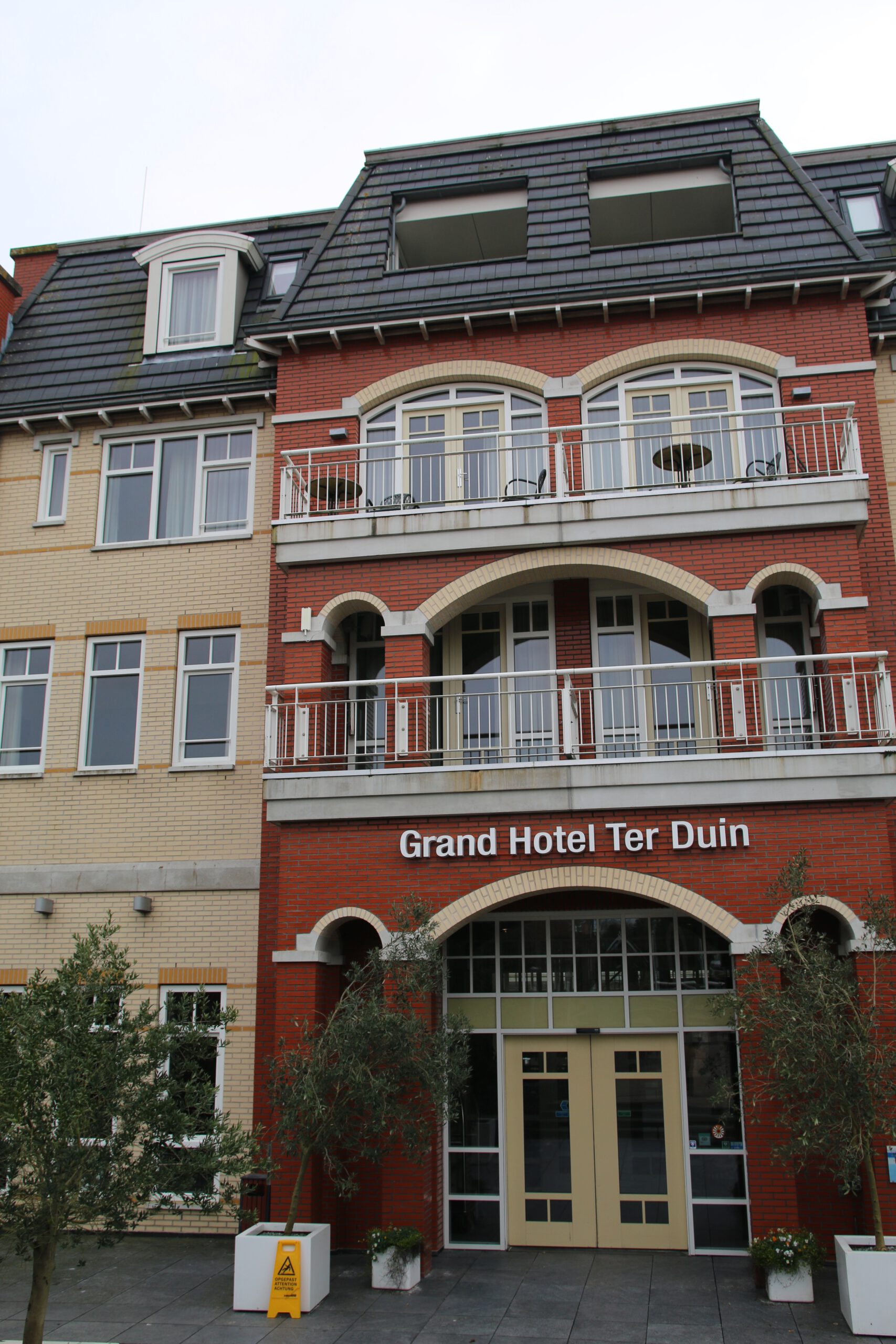 Grand Hotel Ter Duin Burgh Haamstede facade with red brick exterior and balconies in Schouwen Duiveland Zeeland