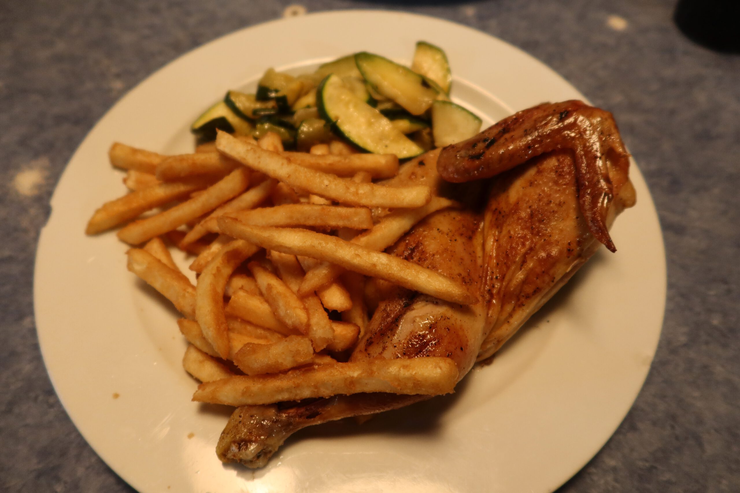 Typical American diner meal at Lucky Buck Cafe in Groveland California, roasted chicken with fries and vegetables, casual roadside dining near Yosemite