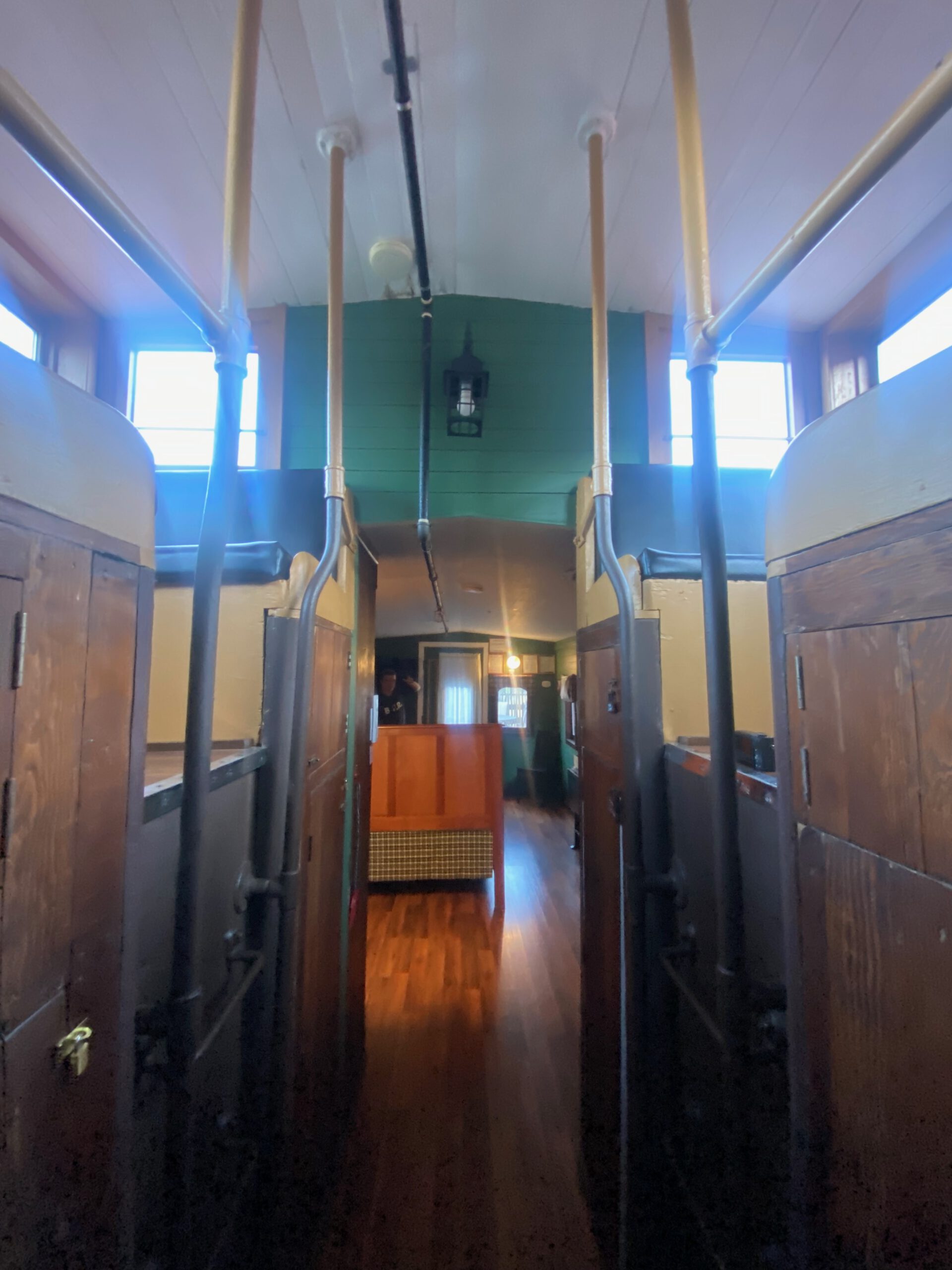 Interior hallway of the Vacation Station caboose, original train layout with wooden details, unique Airbnb stay in Coulterville California