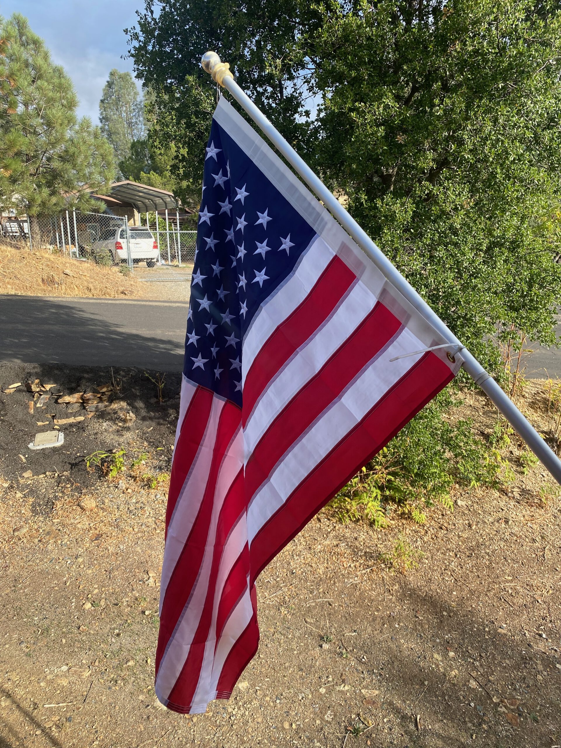 American flag flying outside Vacation Station Coulterville, rural California setting near Yosemite National Park, classic USA road trip atmosphere