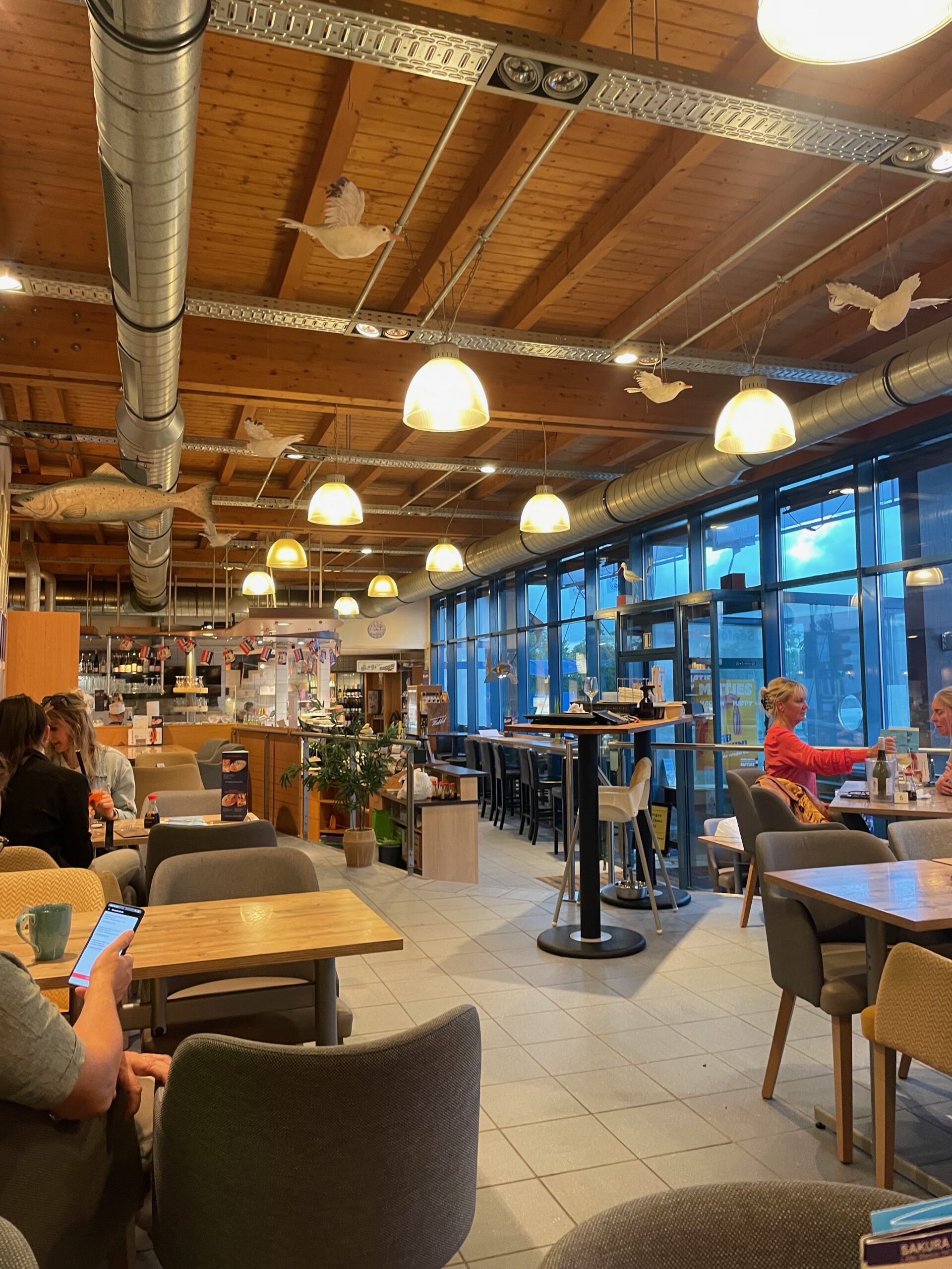Hotel Aal-Kate Wuppertal fish restaurant Wortberg interior with wooden ceiling, open dining area and relaxed atmosphere