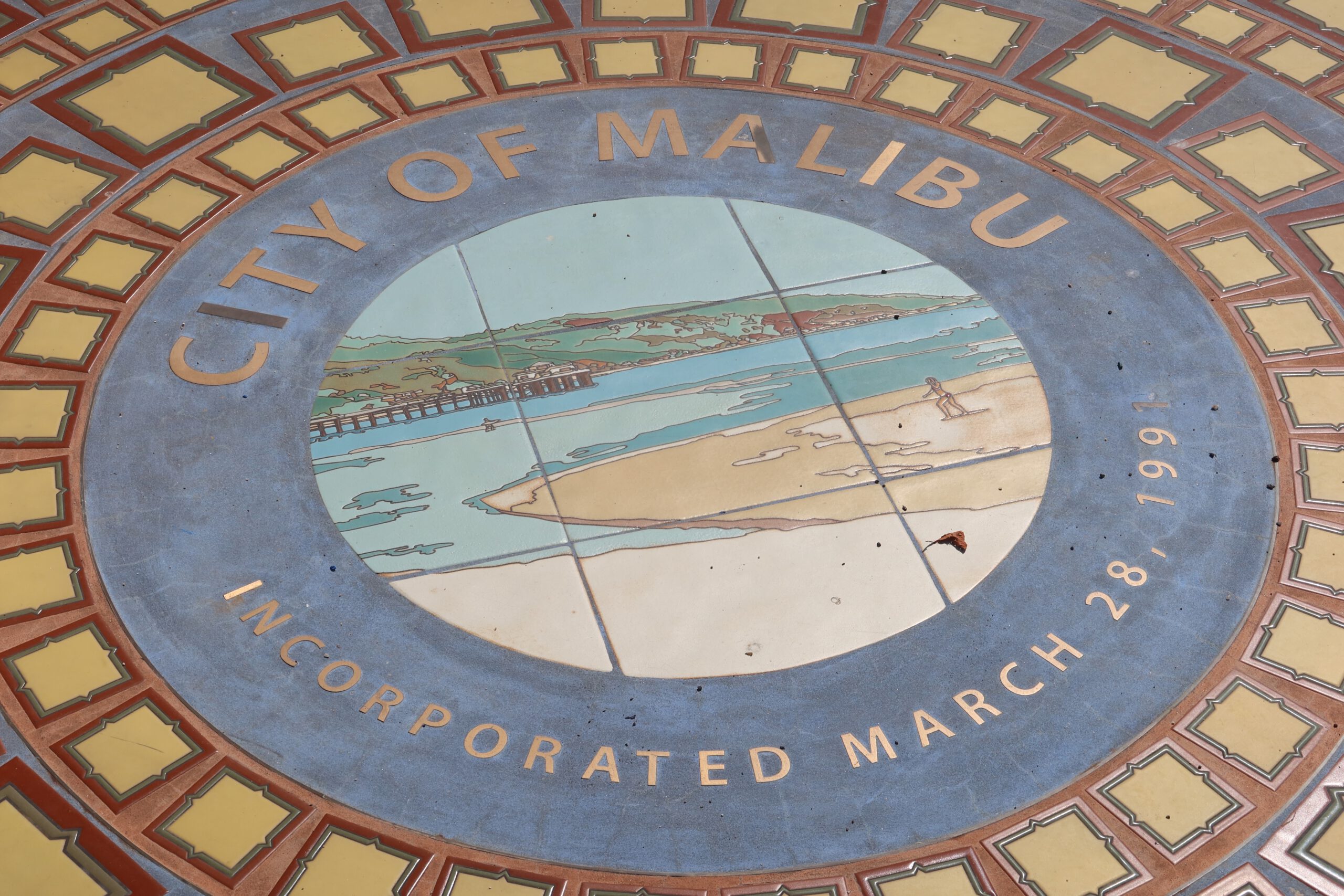 City of Malibu tiled emblem in Legacy Park showing coastal artwork and the official incorporation date, Malibu, California