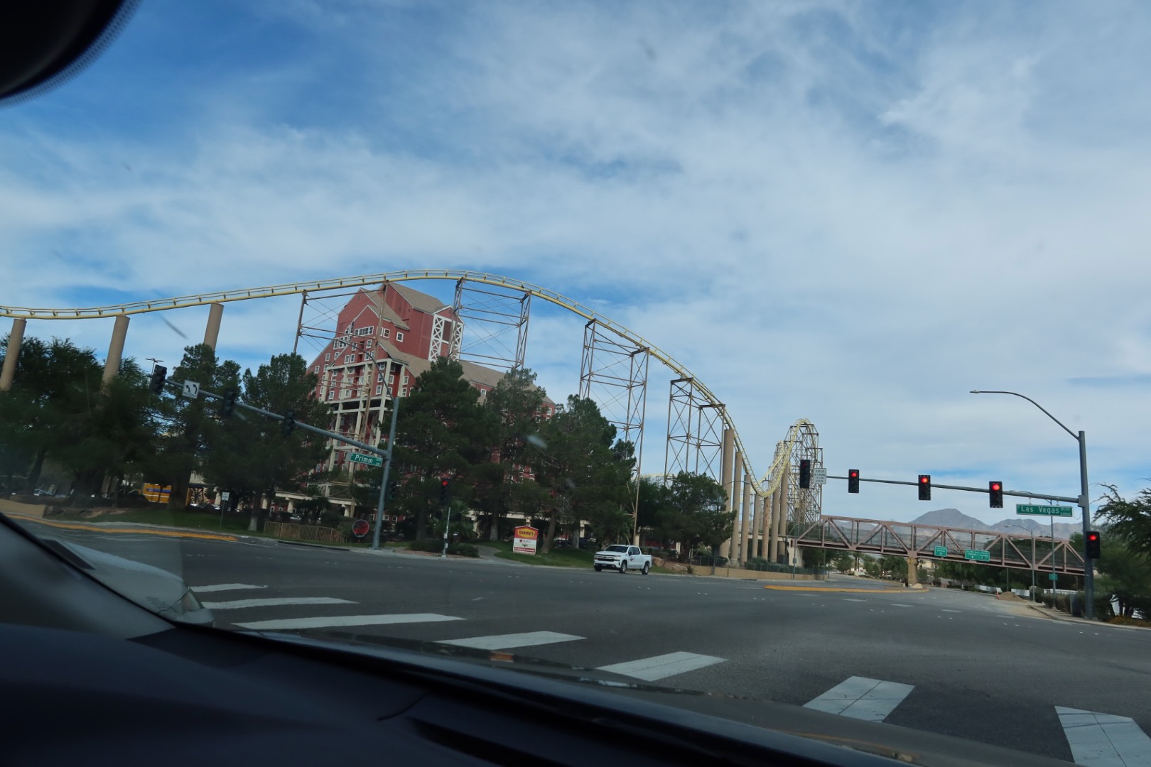 View of Primm Valley casino buildings and roller coaster seen from the road near McDonalds Primm Nevada during a quiet afternoon