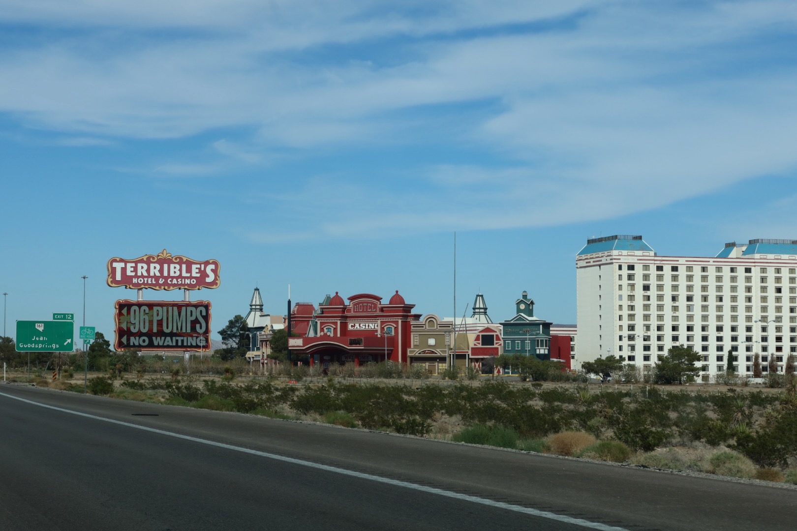 Wide view of Primm Valley Casino Resorts parking area with casino hotels along the highway near McDonalds Primm Nevada in southern Nevada