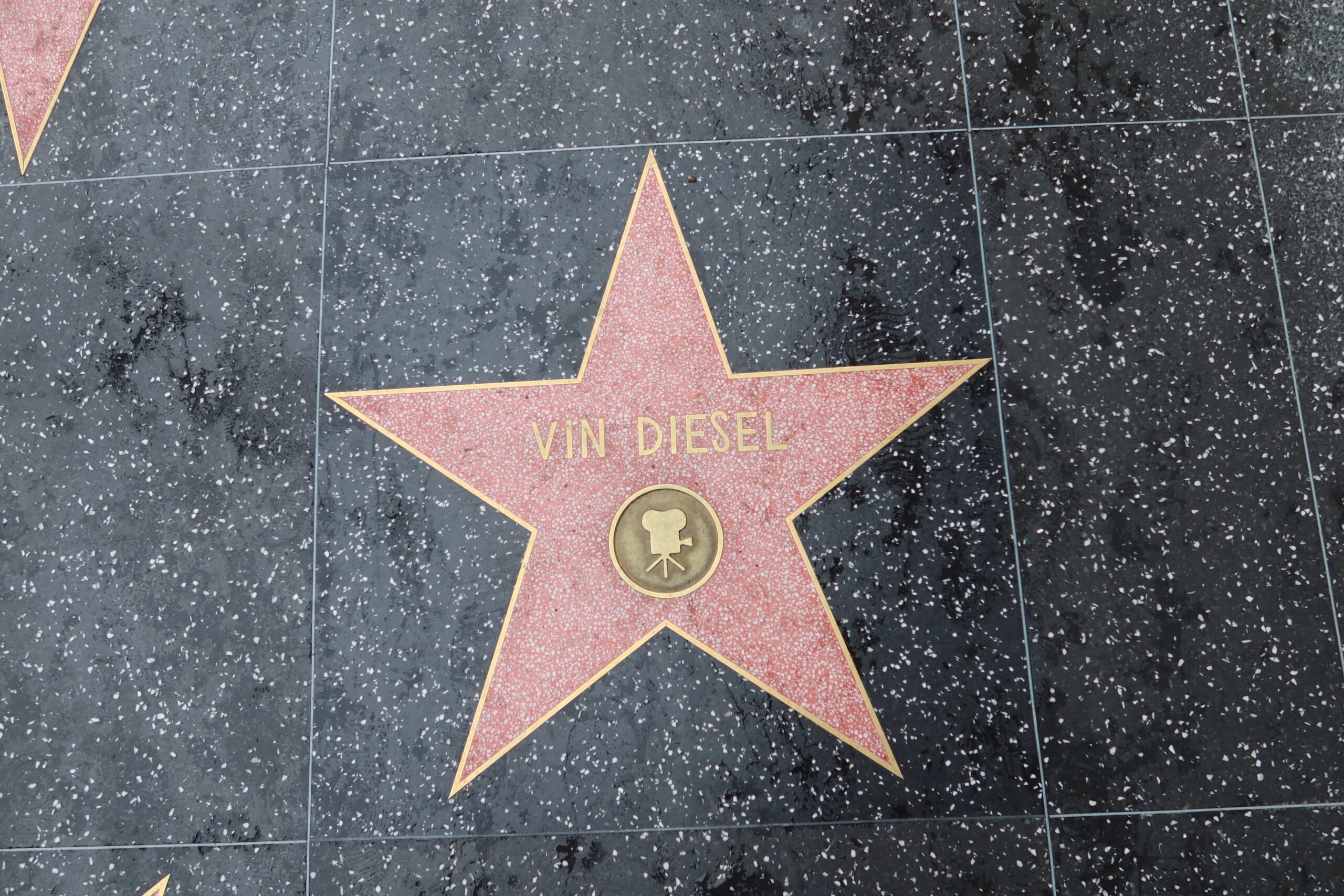 Vin Diesel’s star on the Hollywood Walk of Fame in Los Angeles, photographed on a wet sidewalk along Hollywood Boulevard.