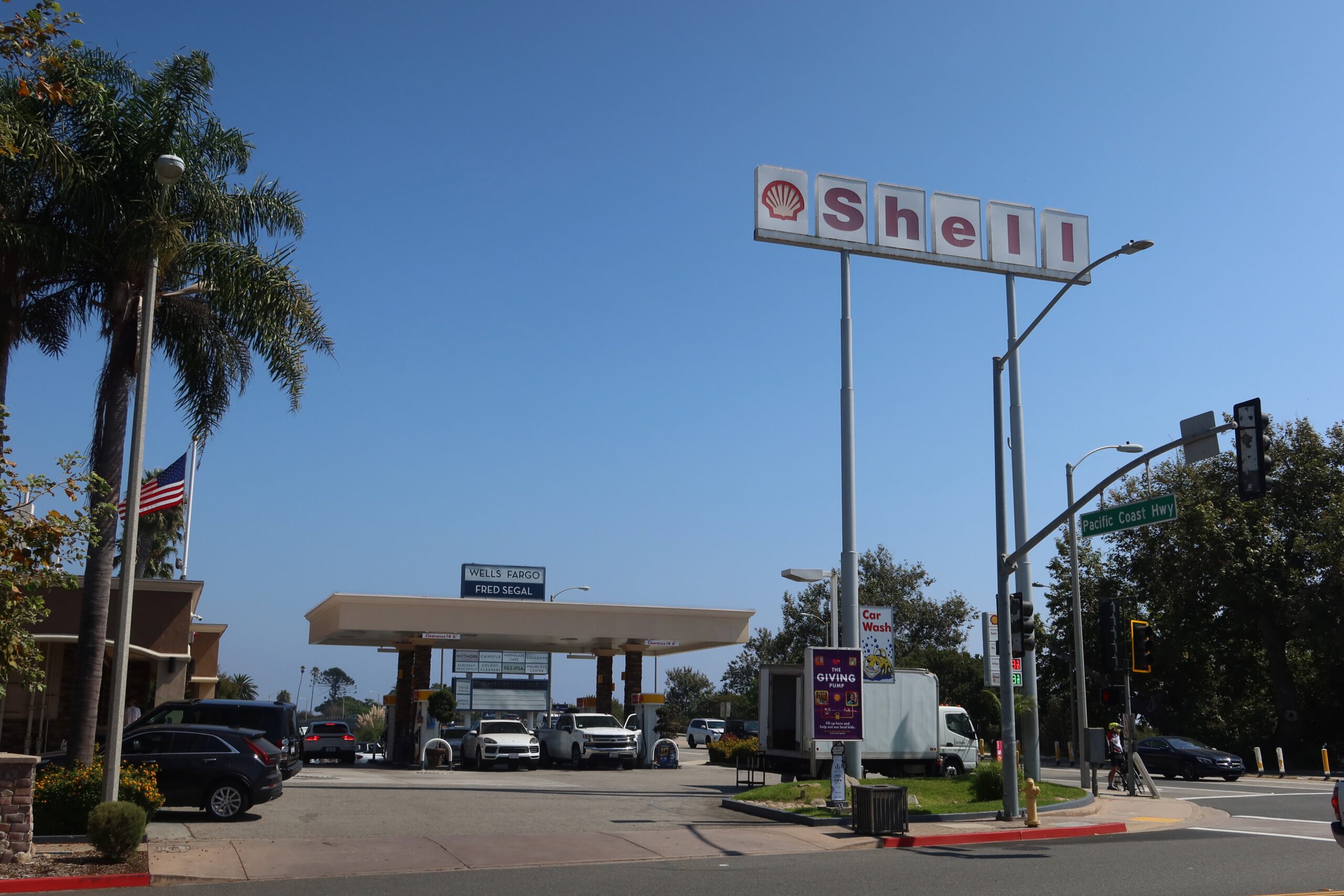 Shell gas station along the Pacific Coast Highway in Malibu, California under clear blue skies