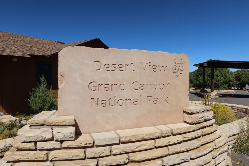 Desert View sign at Grand Canyon National Park entrance, stone monument near Desert View Watchtower on the South Rim in Arizona