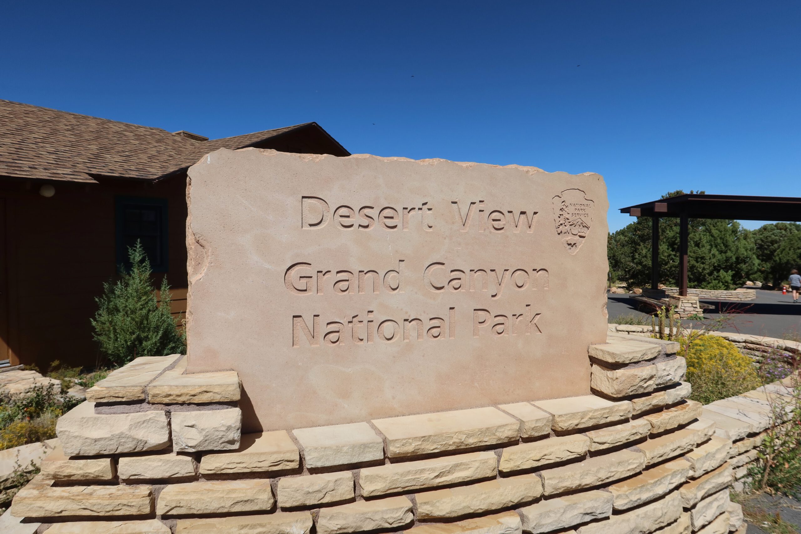 Desert View entrance sign at Grand Canyon National Park under a clear blue sky on the South Rim in Arizona