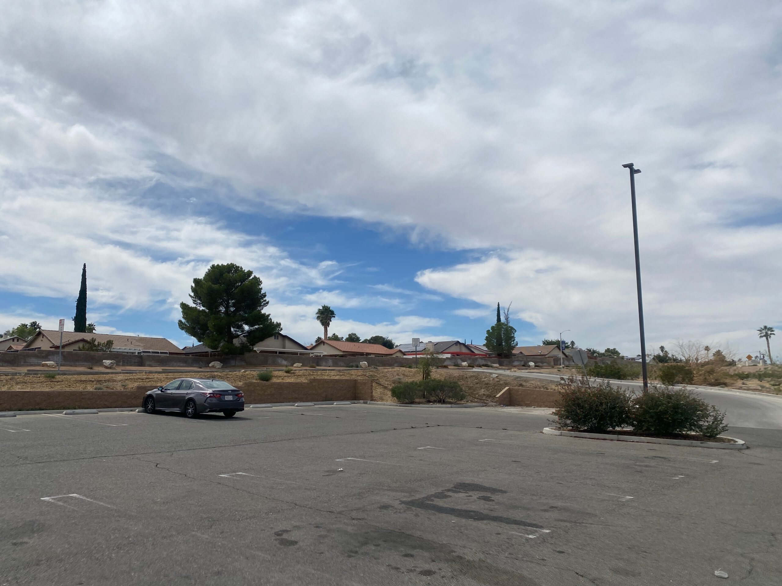 Parking lot at Dollar General Barstow California with open desert surroundings, photographed during a Mojave Desert road trip.