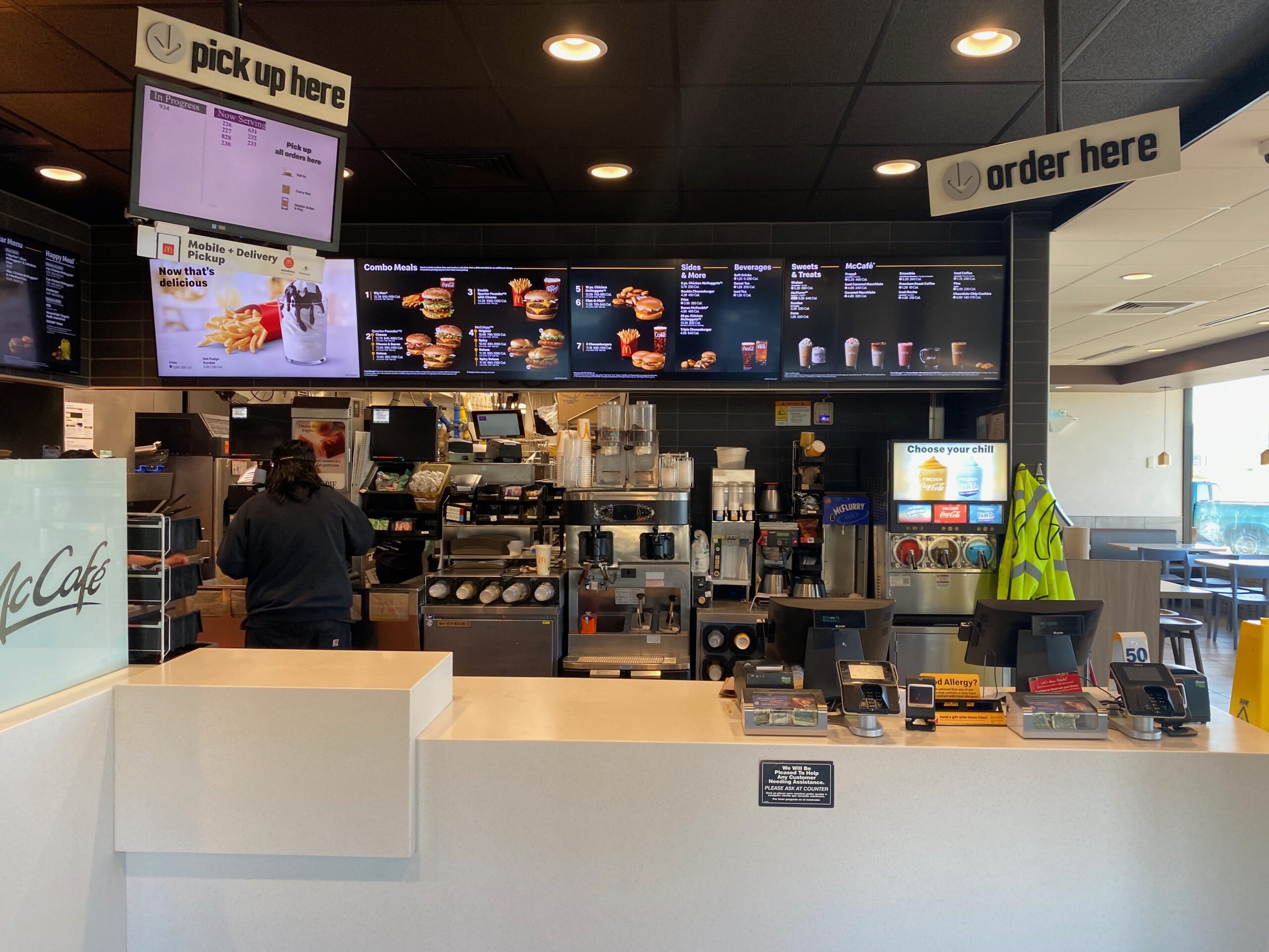 Interior view of McDonald’s Williams Arizona showing order counter pickup screens and classic menu boards during a quiet afternoon stop