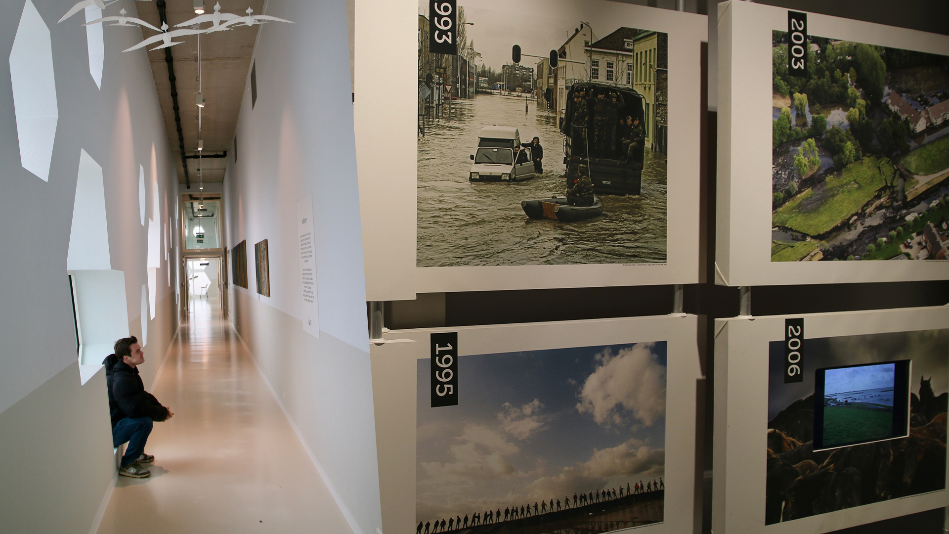Afsluitdijk Wadden Center interior exhibition corridor showcasing historical flood events and climate impact through visual timelines