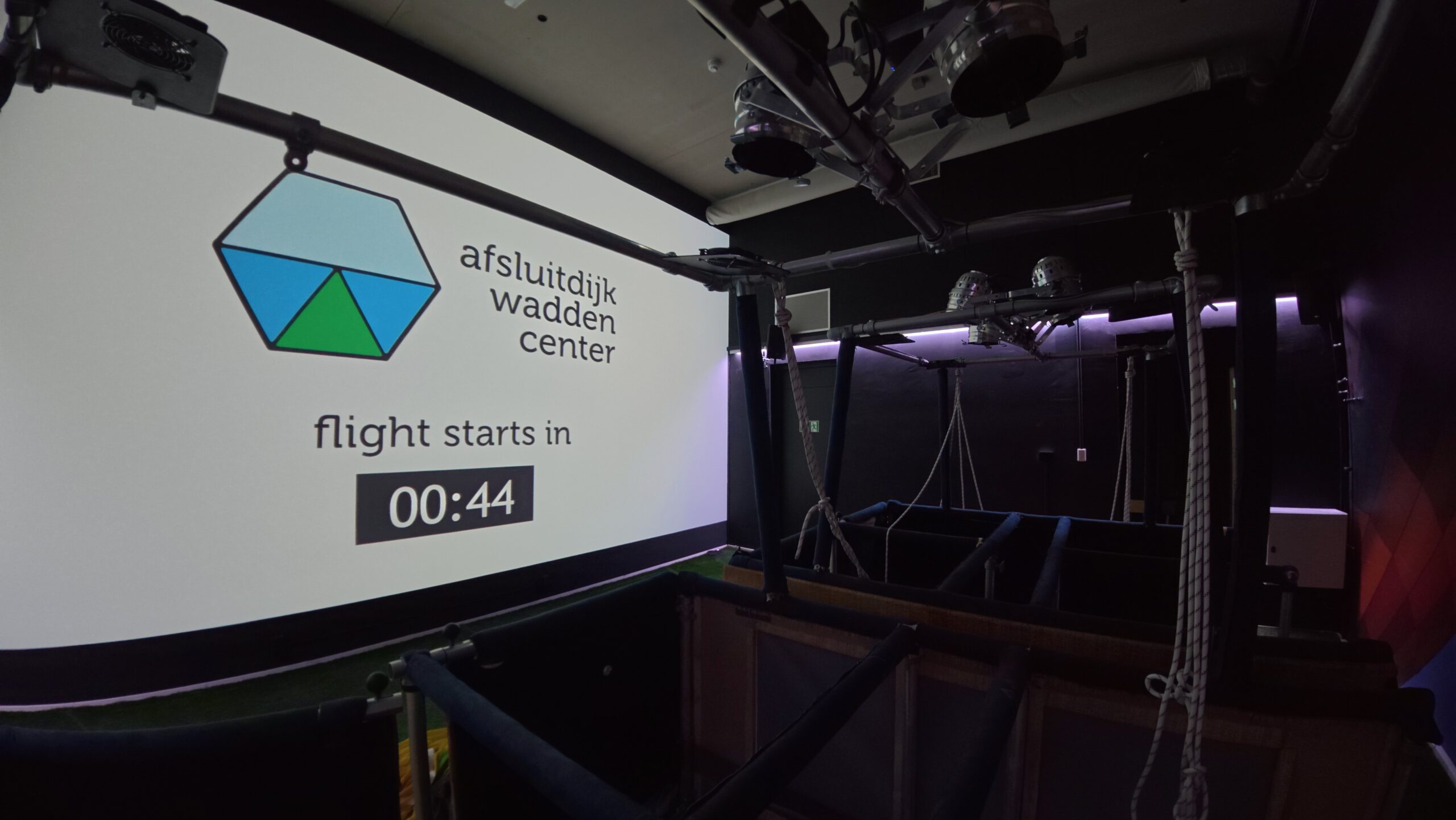 Afsluitdijk Wadden Center balloon flight simulation experience showcasing a virtual aerial journey over the Afsluitdijk