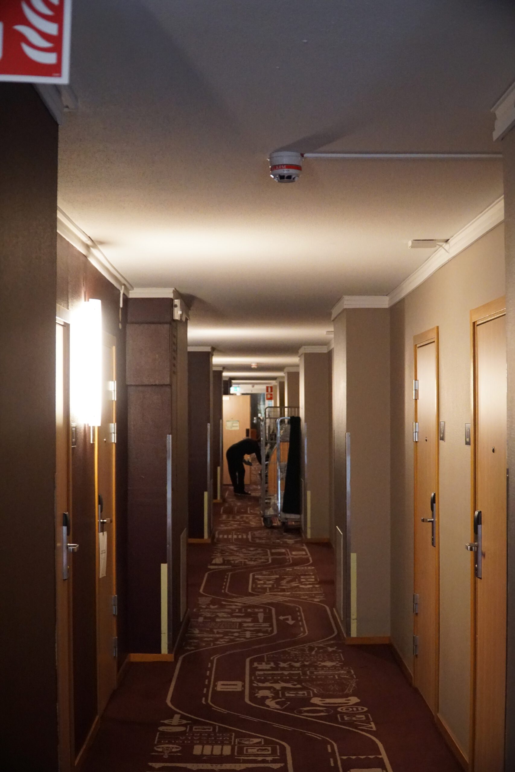 Scandic Luleå Hotel hallway with guest room doors, warm lighting and modern Scandinavian interior design in Luleå Sweden