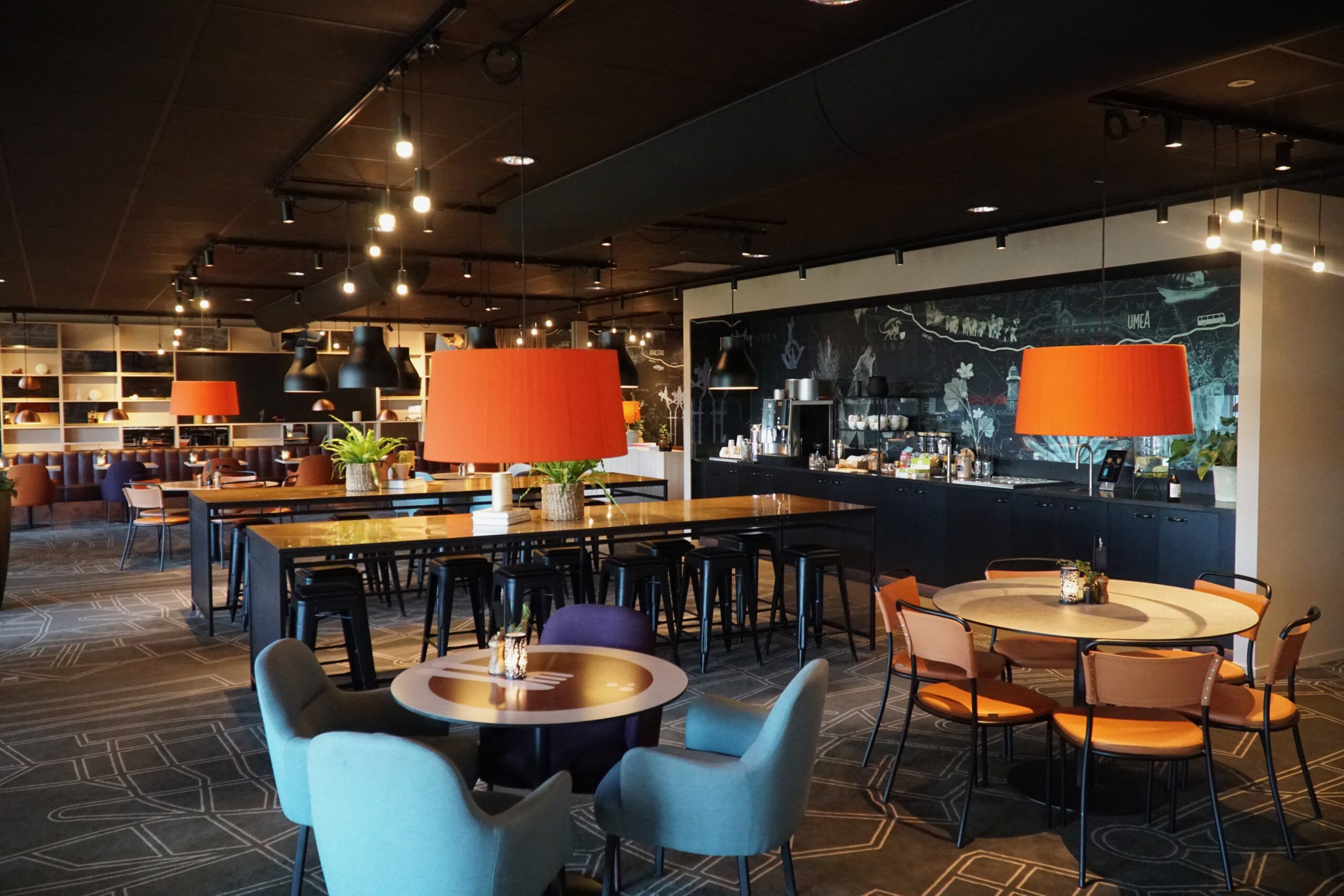 Scandic Luleå Hotel breakfast restaurant interior with large buffet area, modern seating and warm lighting in Luleå Sweden