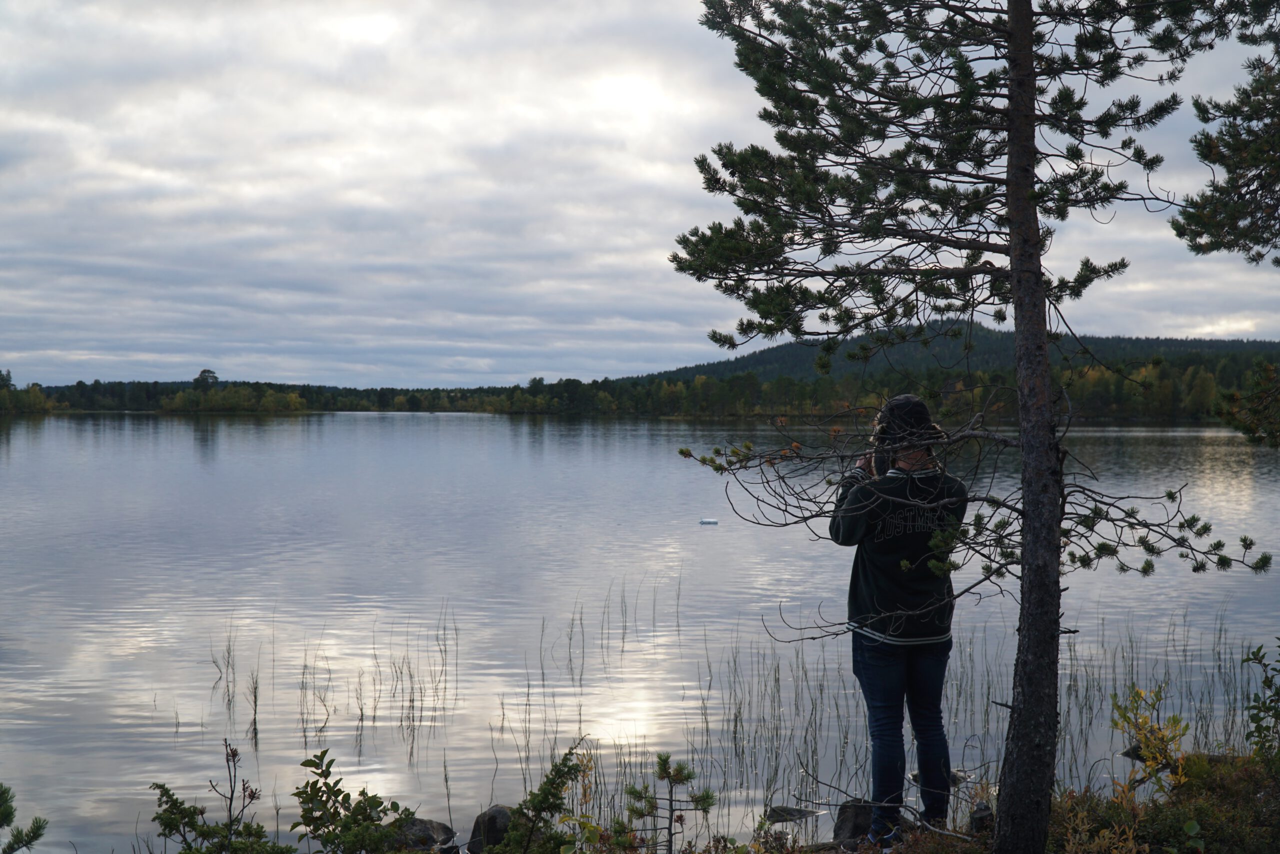 Hetan Kota Enontekiö Finland peaceful lakeside view with Peter Smit standing by the water, quiet Lapland nature and reflection