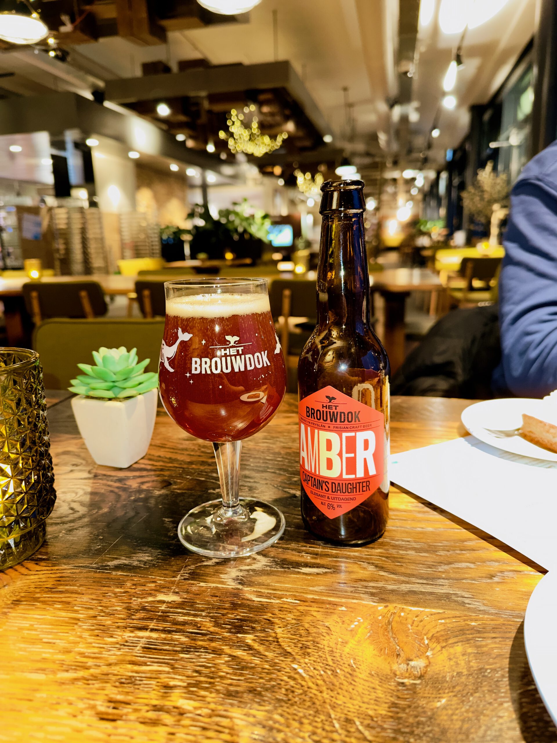 Local craft beer served at Restaurant Skom inside the Afsluitdijk Wadden Center, highlighting regional flavors and relaxed atmosphere