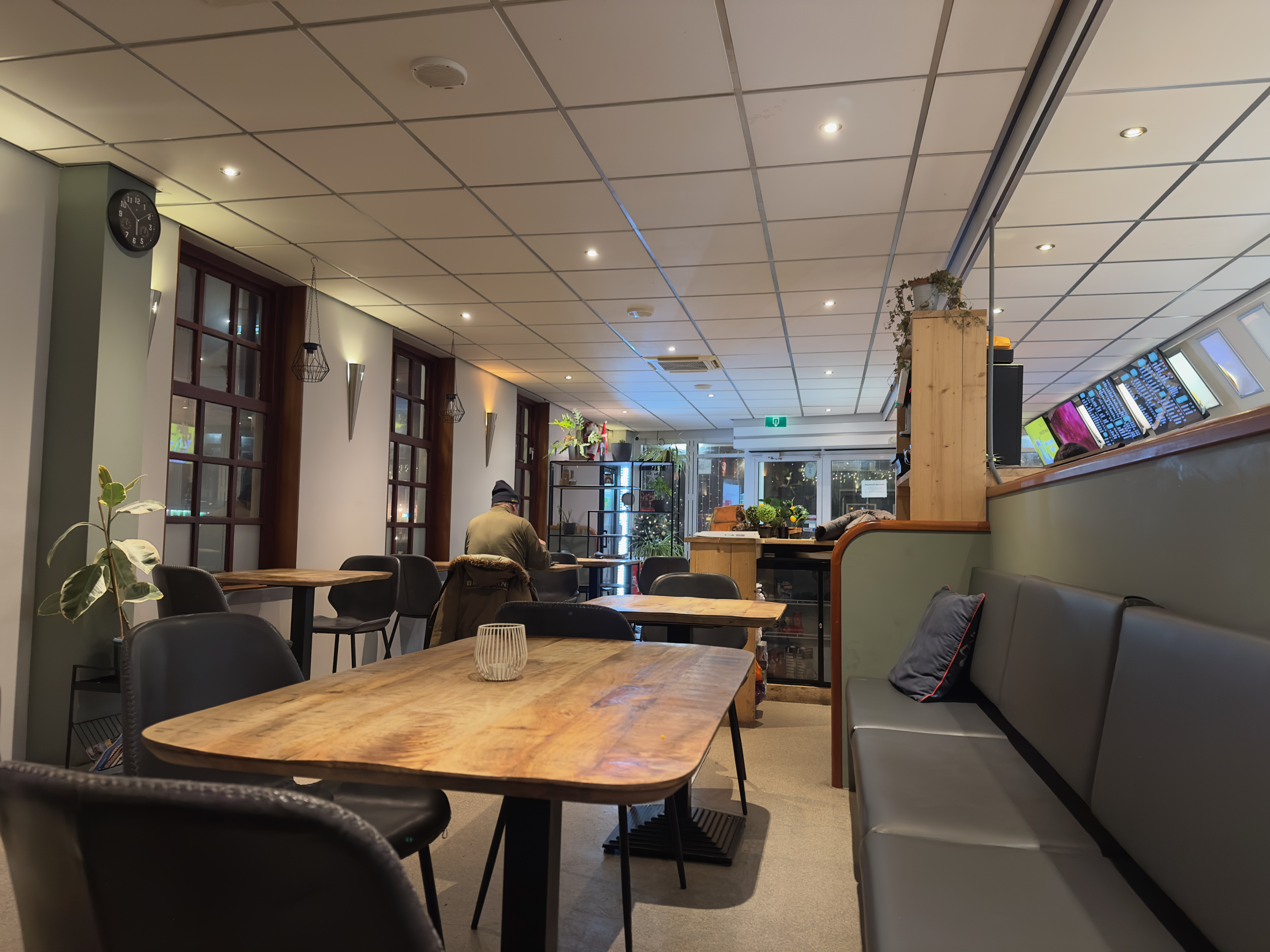 Interior of Barry’s Eethuis Makkum during dinner time, showing a cozy seating area inside this popular local snack bar in Friesland