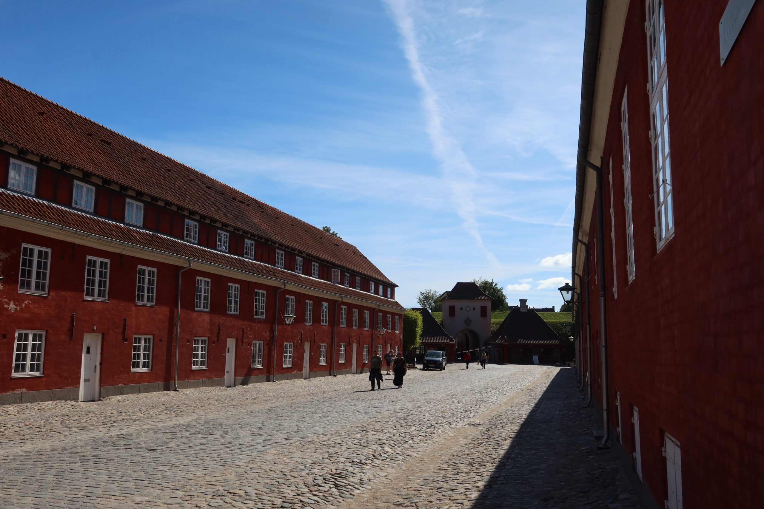 Kastellet Copenhagen inner street with historic red barracks, cobblestone road and classic Scandinavian military architecture