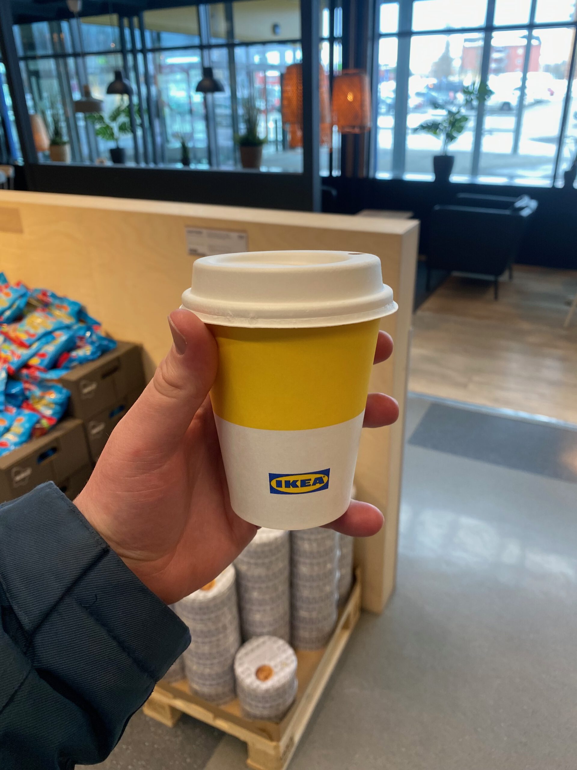 IKEA Haparanda Restaurant and Store food corner showing a takeaway coffee cup with IKEA branding inside the store