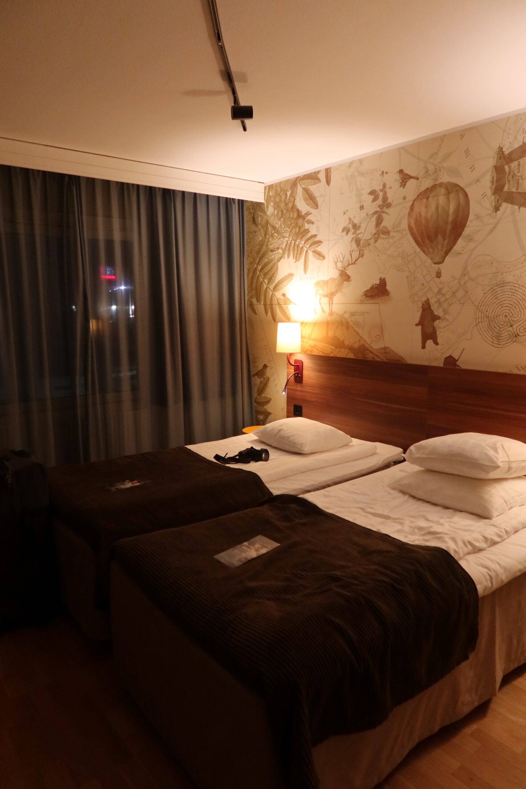 Scandic Luleå Hotel room interior with twin beds, comfortable bedding and cozy Scandinavian design in Luleå Sweden