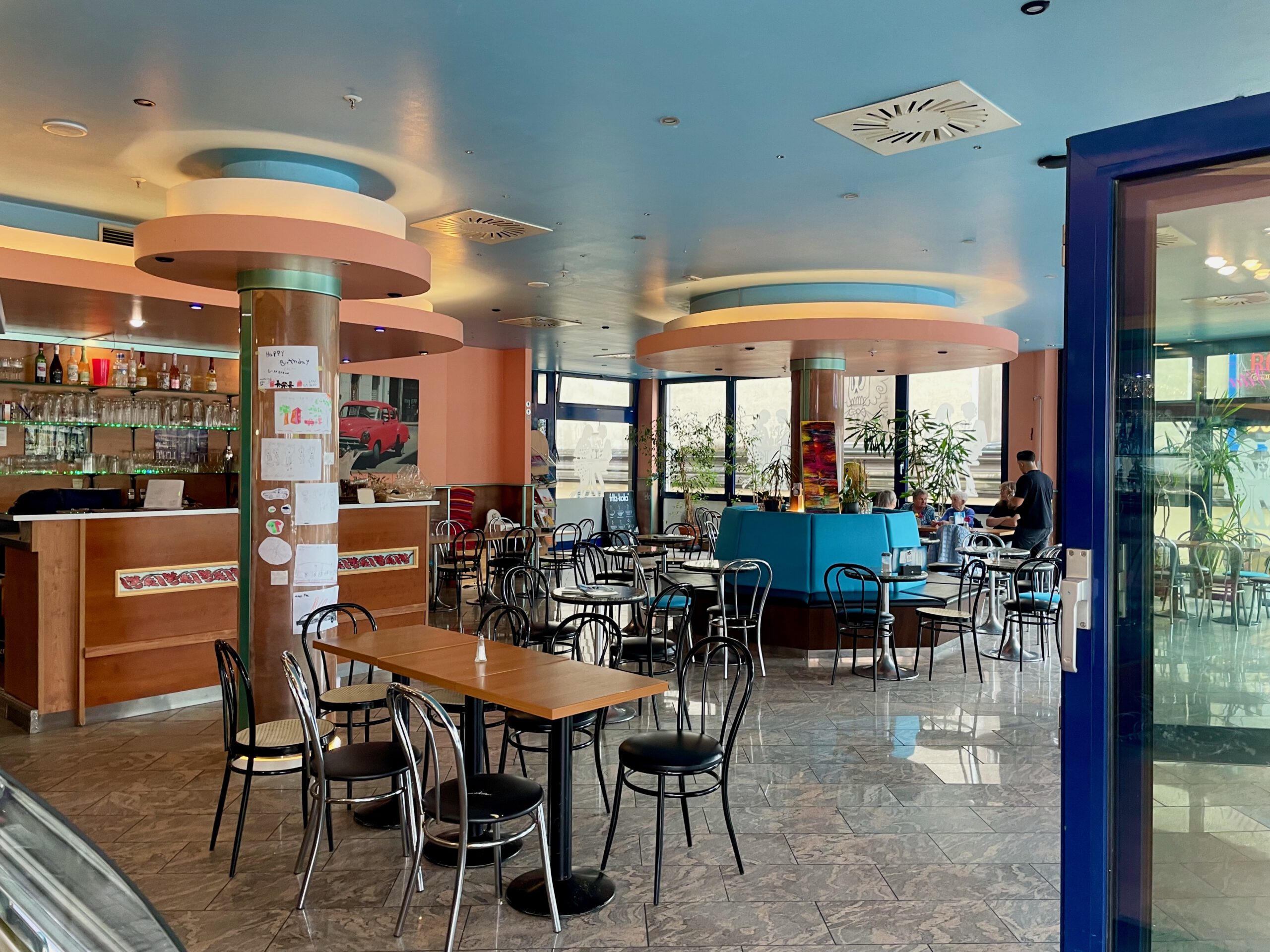 Seating area inside Eiscafé La Vita Wuppertal showing the spacious interior, café tables and relaxed atmosphere