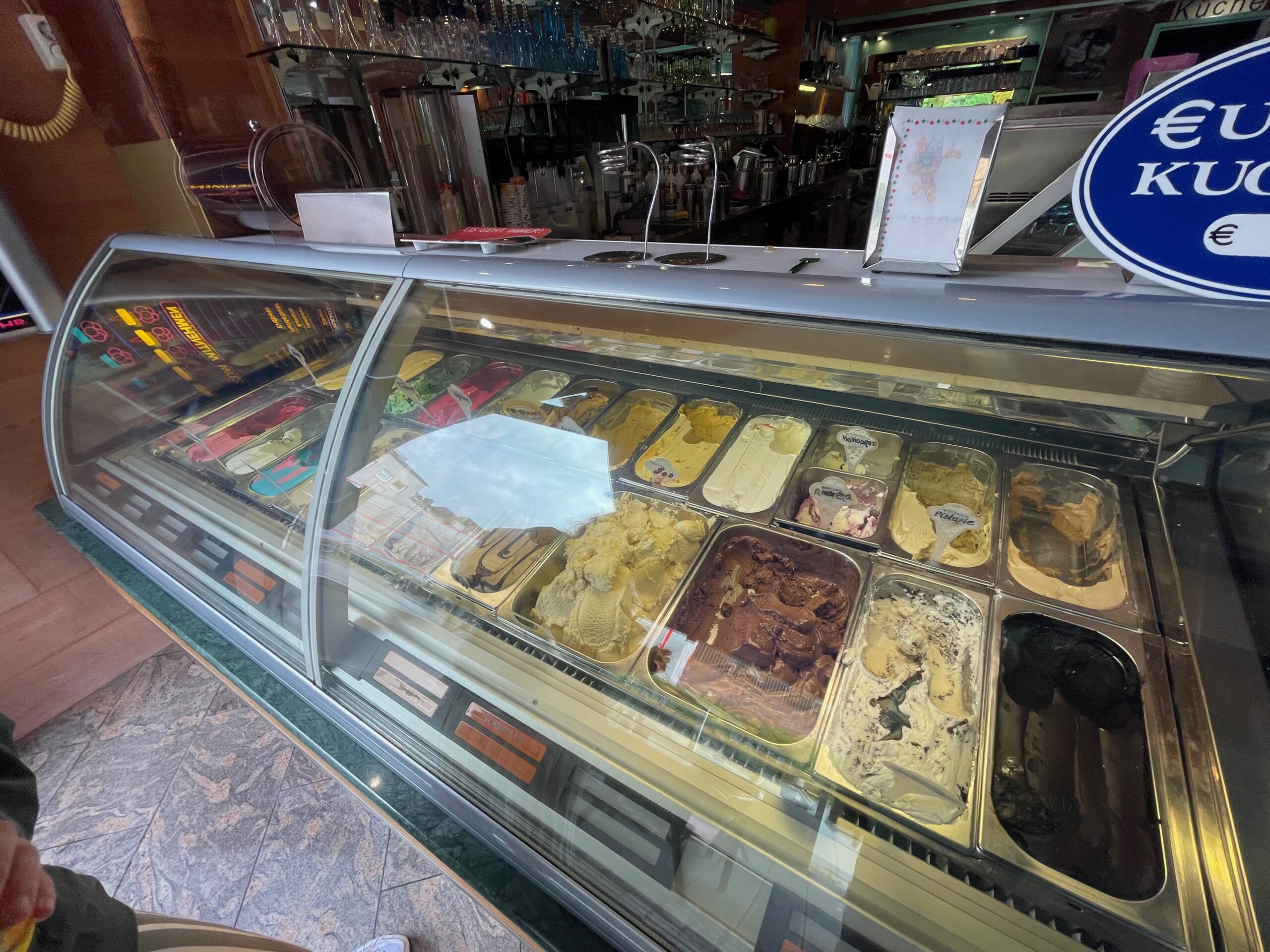 Ice cream display at Eiscafé La Vita Wuppertal showing a wide selection of German scoop ice cream flavors in the counter