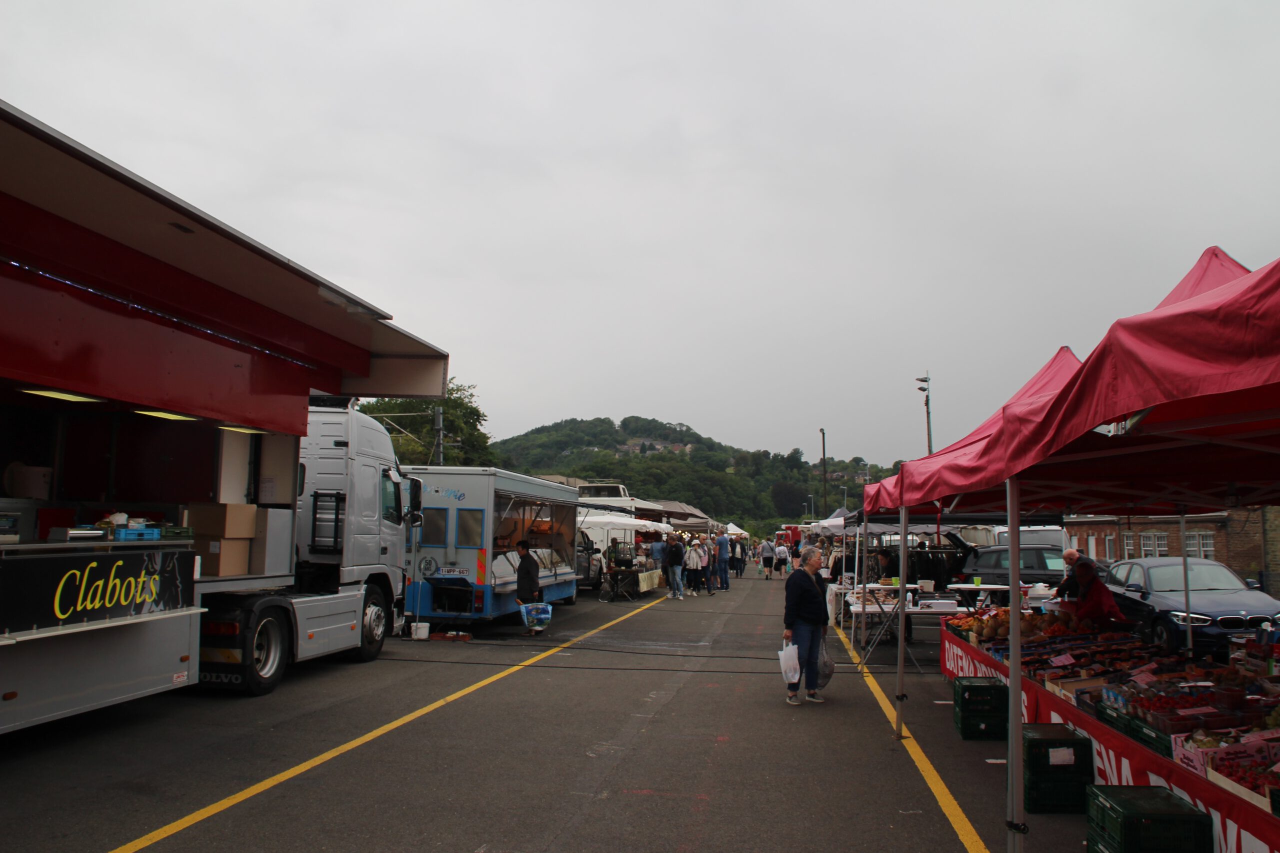 Aywaille Market on a Saturday morning, showing market stalls, food trucks, local vendors and visitors walking through the weekly market in Aywaille