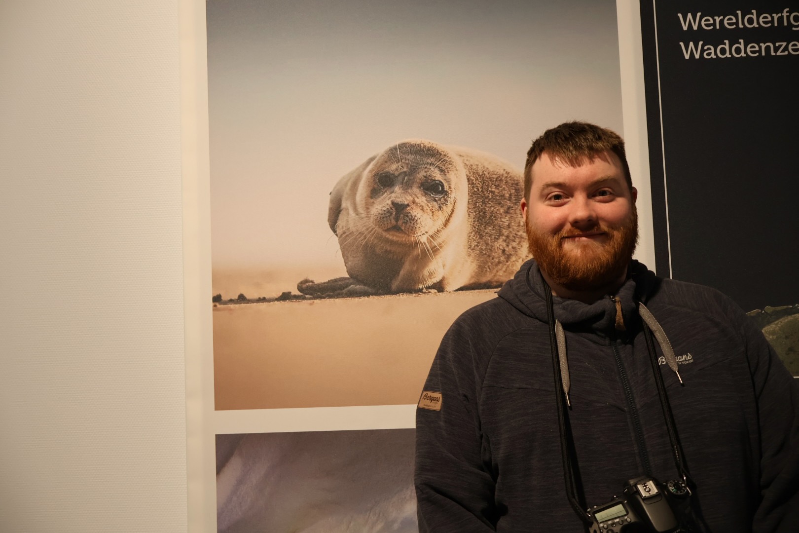 Afsluitdijk Wadden Center exhibition featuring Wadden Sea wildlife photography displayed inside the museum, with Timo van den Berg finding out