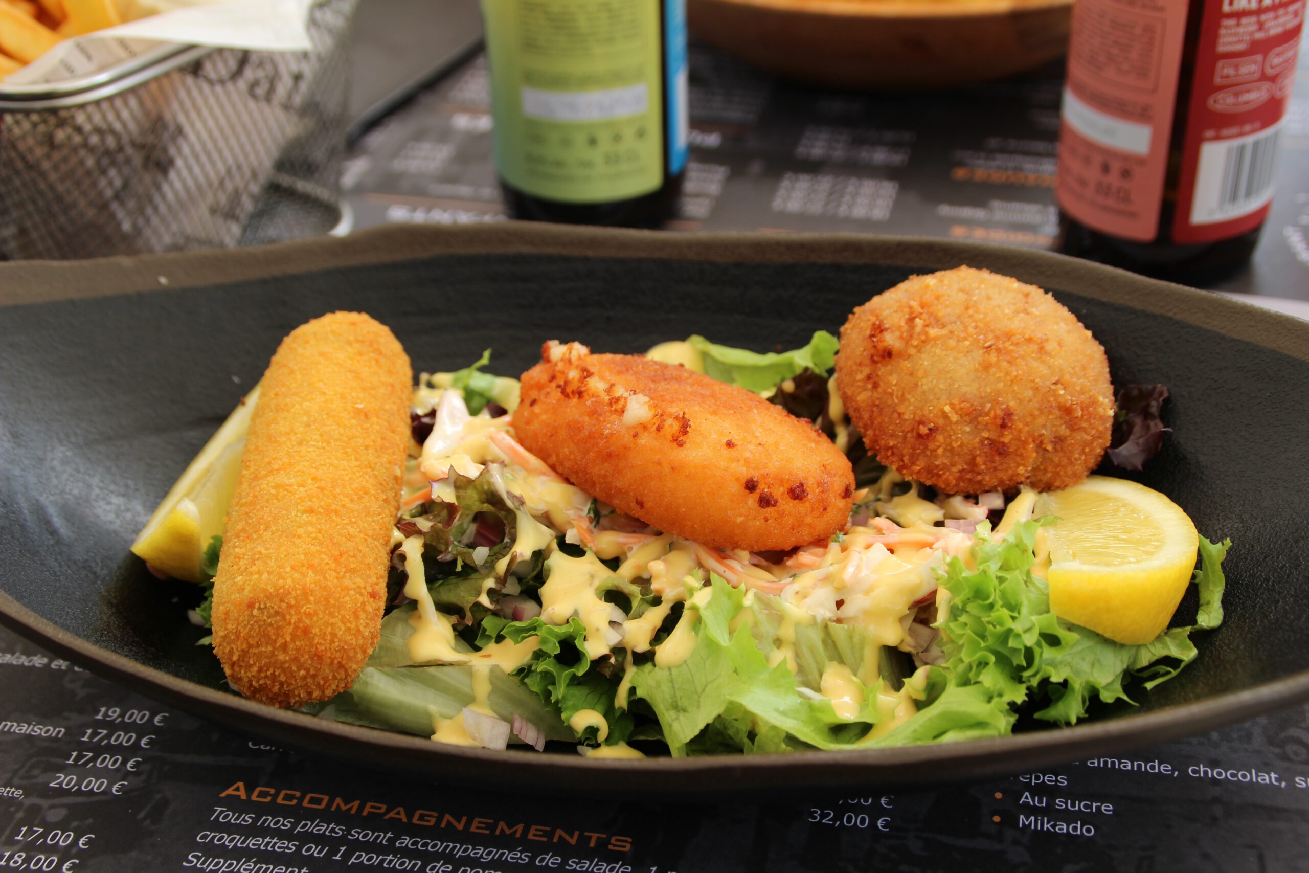 La Table de Spa lunch croquettes served on fresh salad with lemon, classic Belgian brasserie dish in Spa Belgium