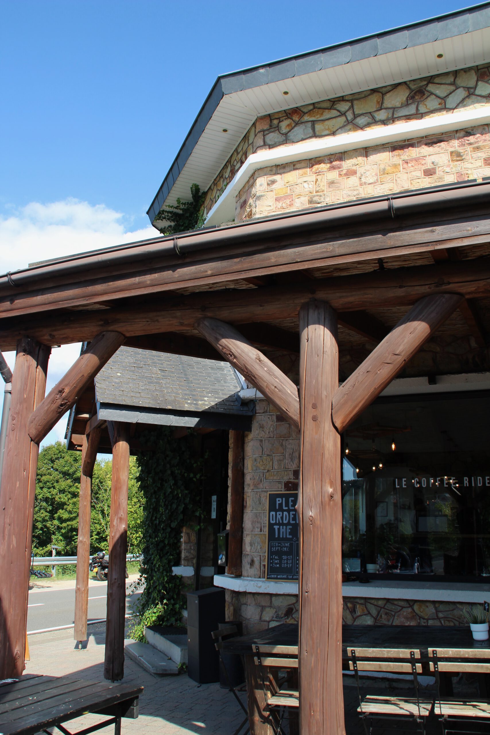 Le Coffee Ride restaurant exterior in the Belgian Ardennes, rustic wooden architecture and café entrance in Stavelot