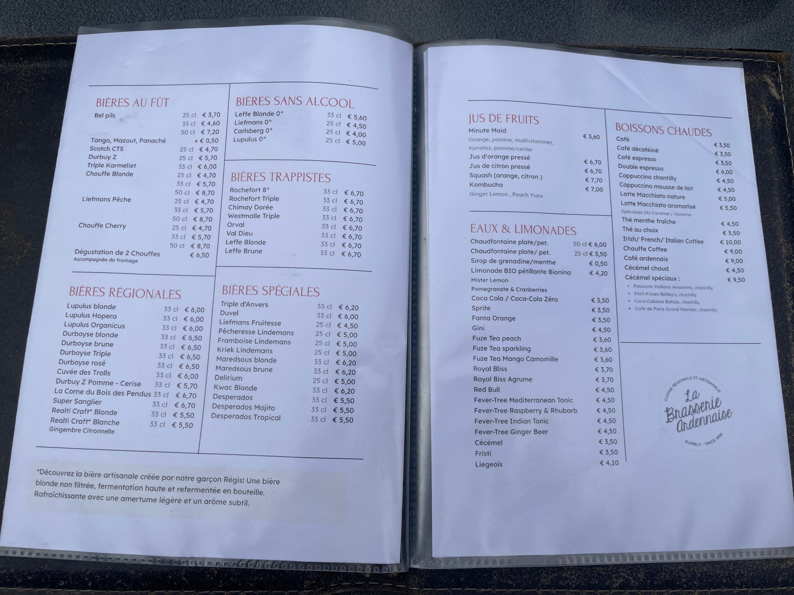 Drinks menu at La Brasserie Ardennaise Durbuy showing Belgian beers, hot drinks, juices, and regional specialties