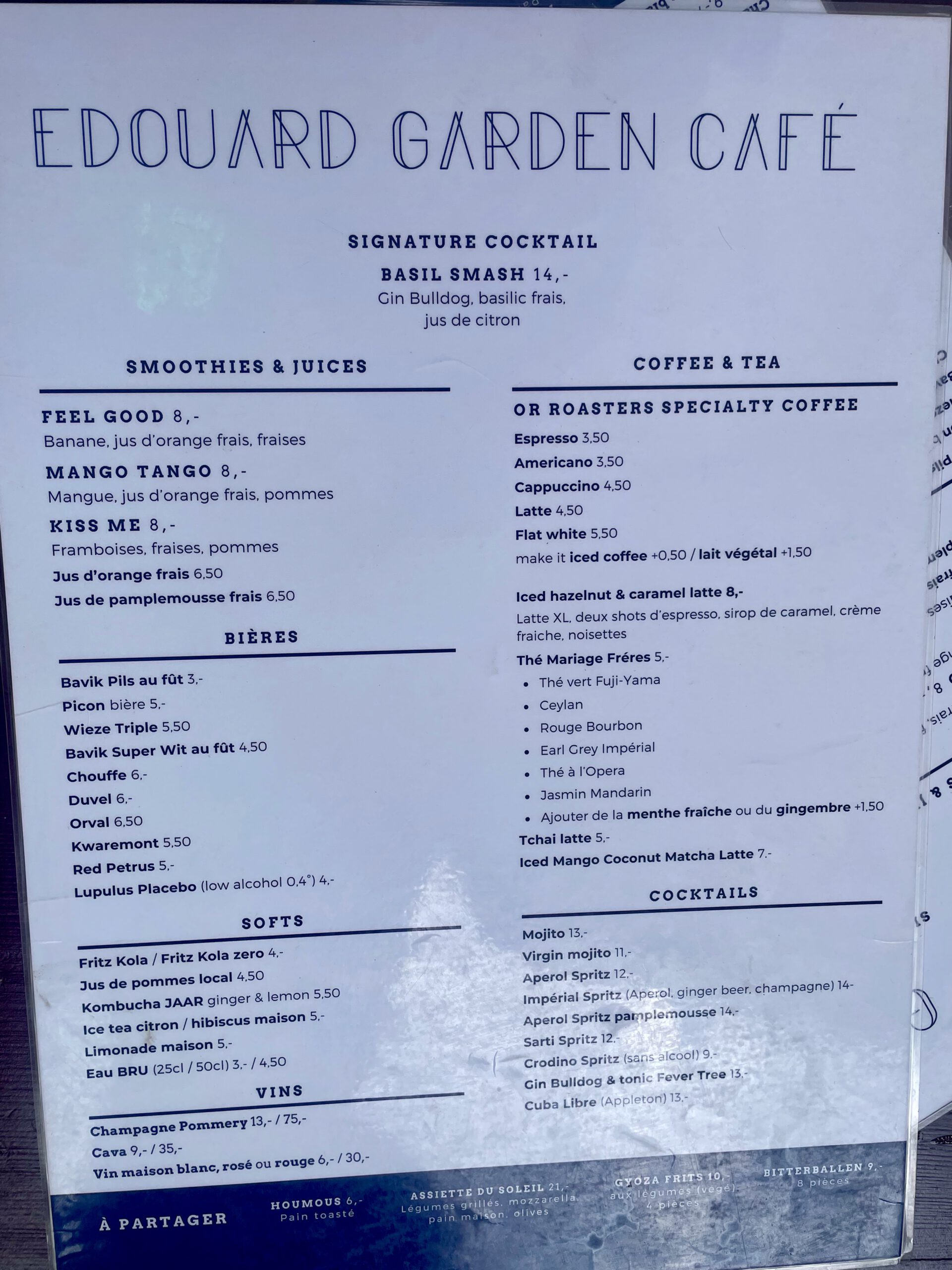 Edouard Garden Café Durbuy menu showing signature cocktails, specialty coffee, tea selection, smoothies, fresh juices, Belgian beers, wines, and classic cocktails in a modern garden café setting