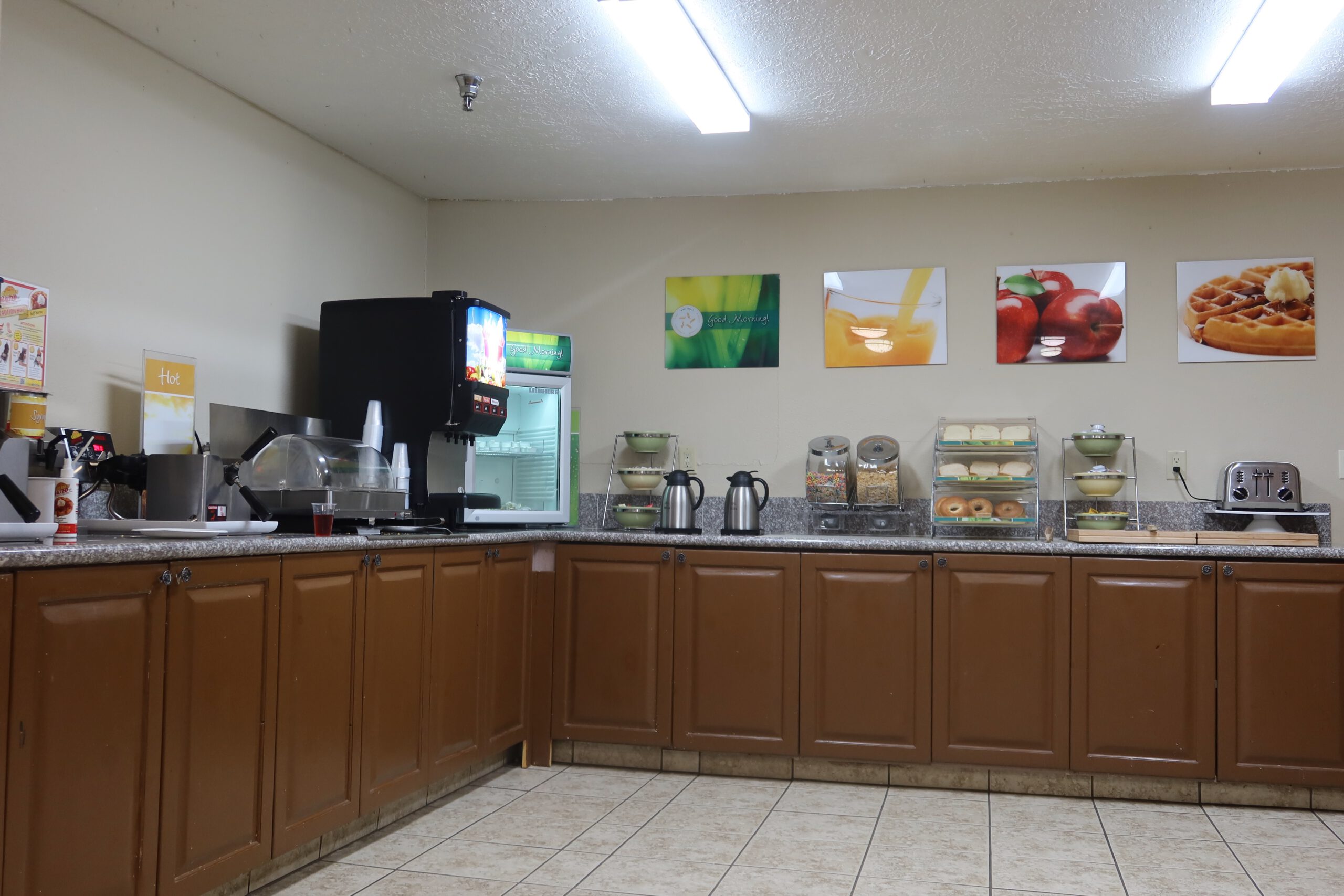 Free breakfast buffet at Quality Inn Kanab National Park Area featuring waffles, cereal, bagels, coffee, and juice options