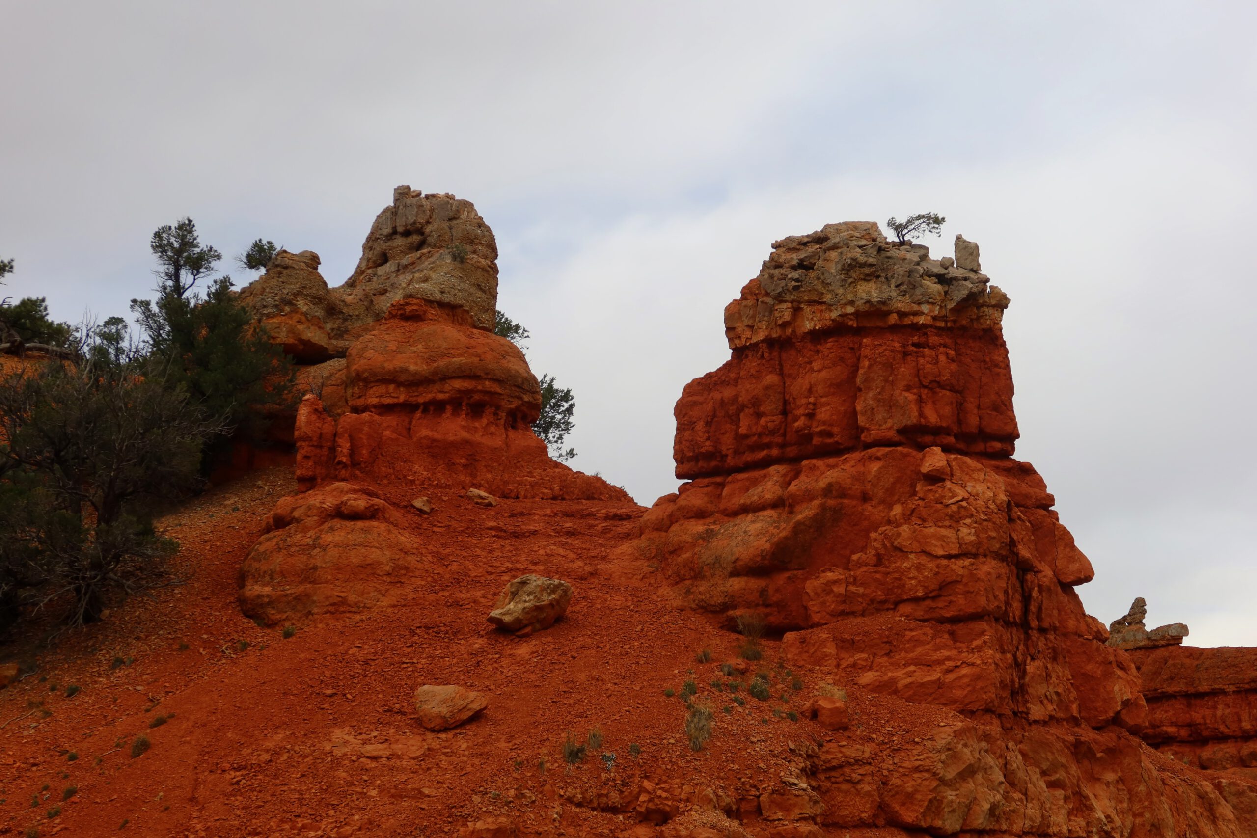 Layered red rock hoodoo formations in Dixie National Forest, Utah, highlighting the unique geology of the Red Canyon area
