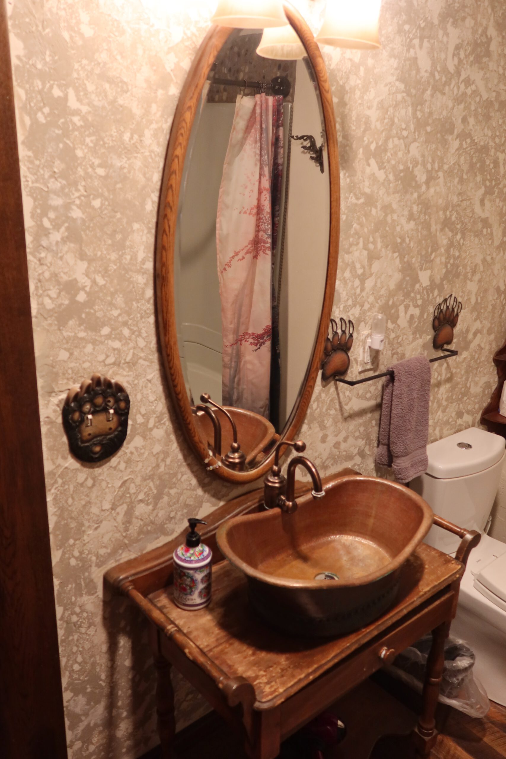 Rustic bathroom sink with copper basin at Park Hotel Yellowstone in Gardiner Montana