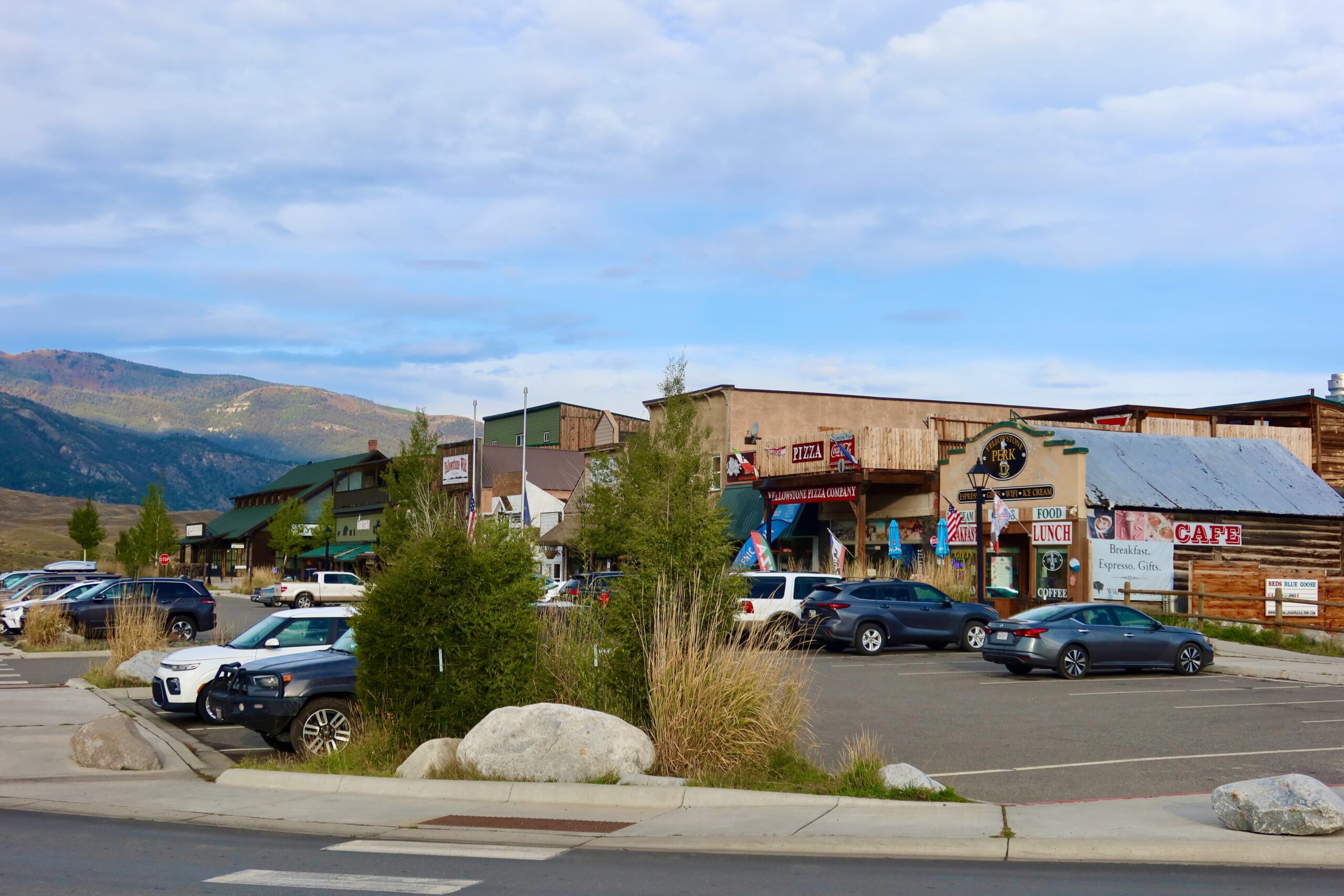 Gardiner Montana town center near Yellowstone National Park, western style shops cafes and parked cars along Main Street