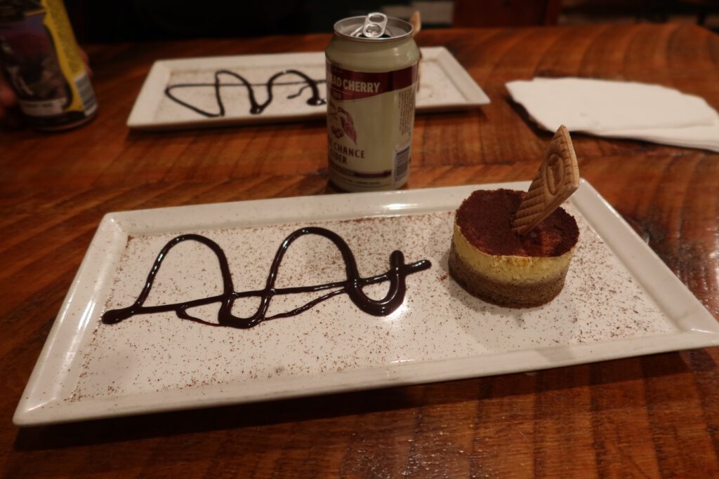Chocolate tiramisu dessert with cocoa powder and chocolate sauce at Cowboy’s Lodge and Grill in Gardiner, Montana.