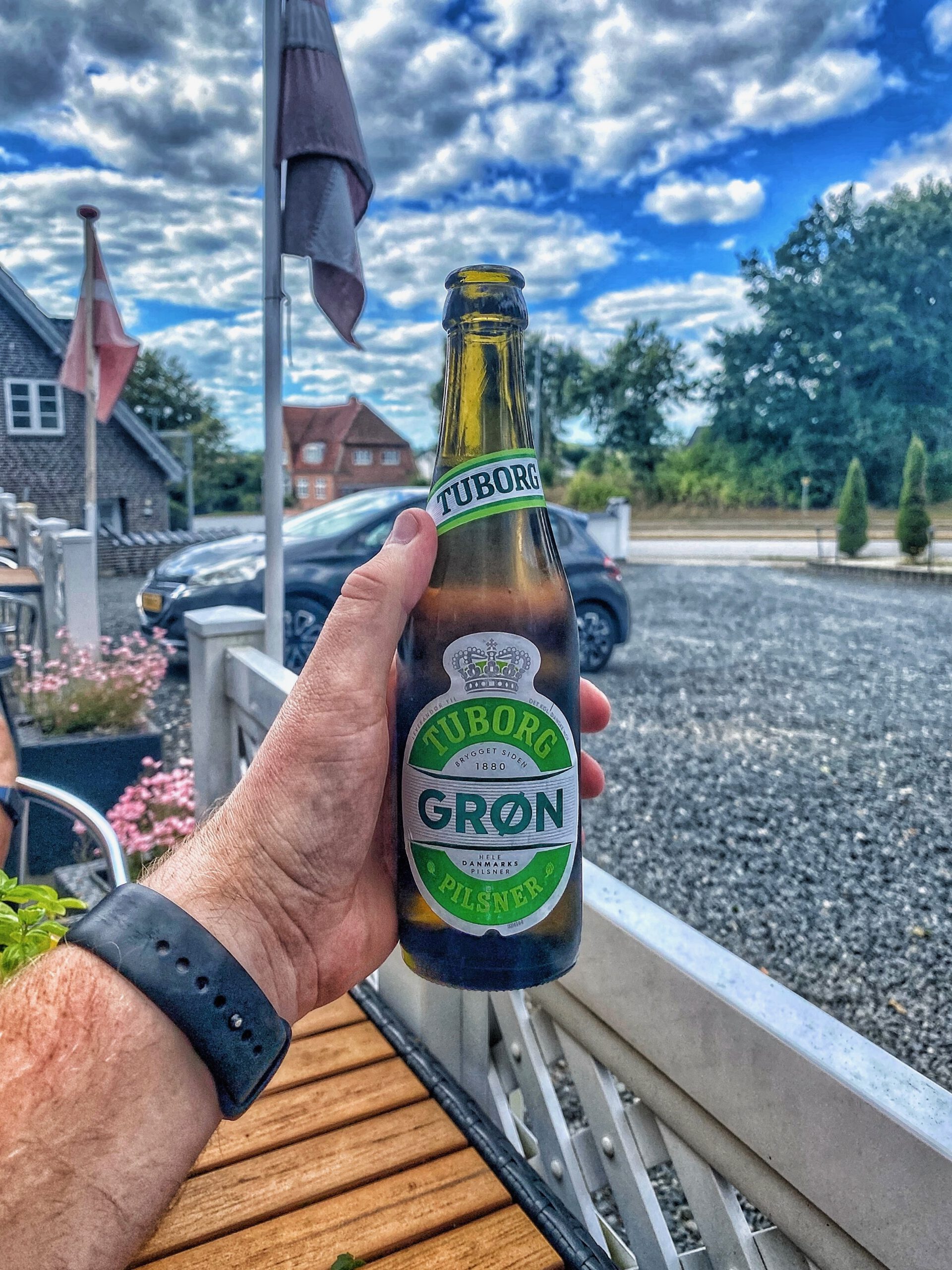 Tuborg Grøn beer enjoyed at Menu Pizzeria & Grill Kruså terrace near the Danish German border