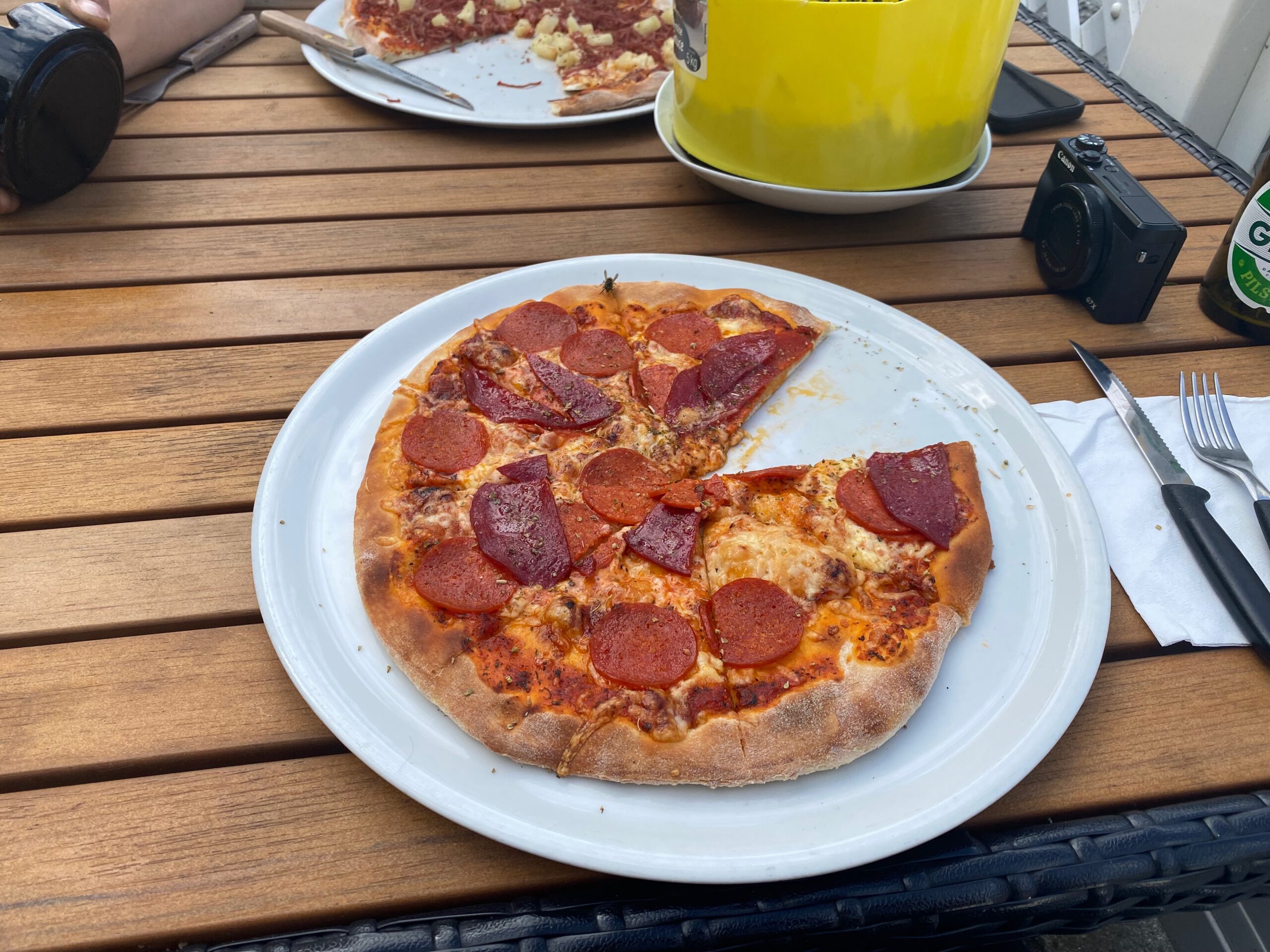 Pepperoni pizza served at Menu Pizzeria & Grill Kruså, classic pizza lunch during a road trip stop