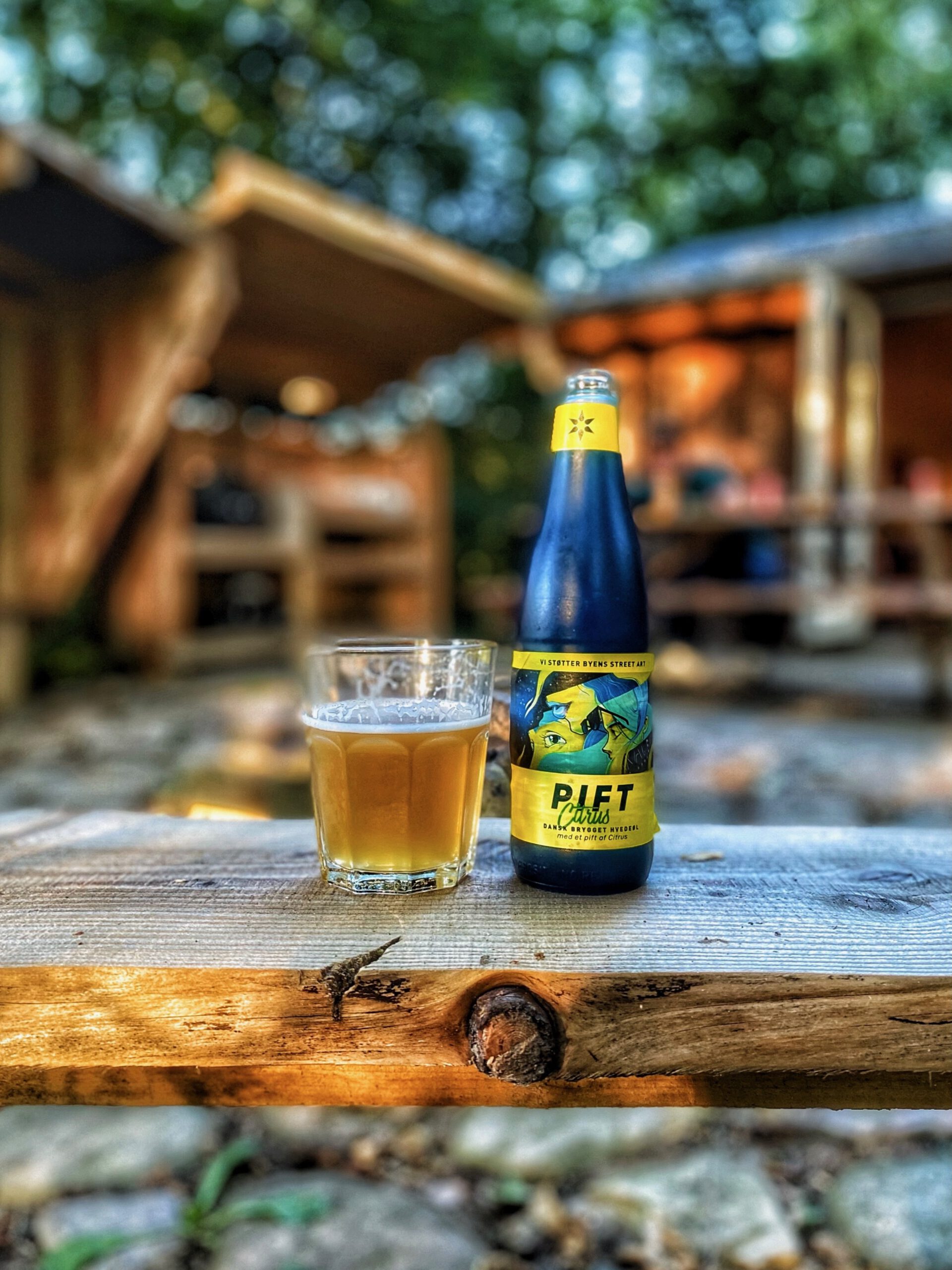 Solevad Cottage in the Forest, Danish craft beer and glass enjoyed at an outdoor seating area in a peaceful forest setting