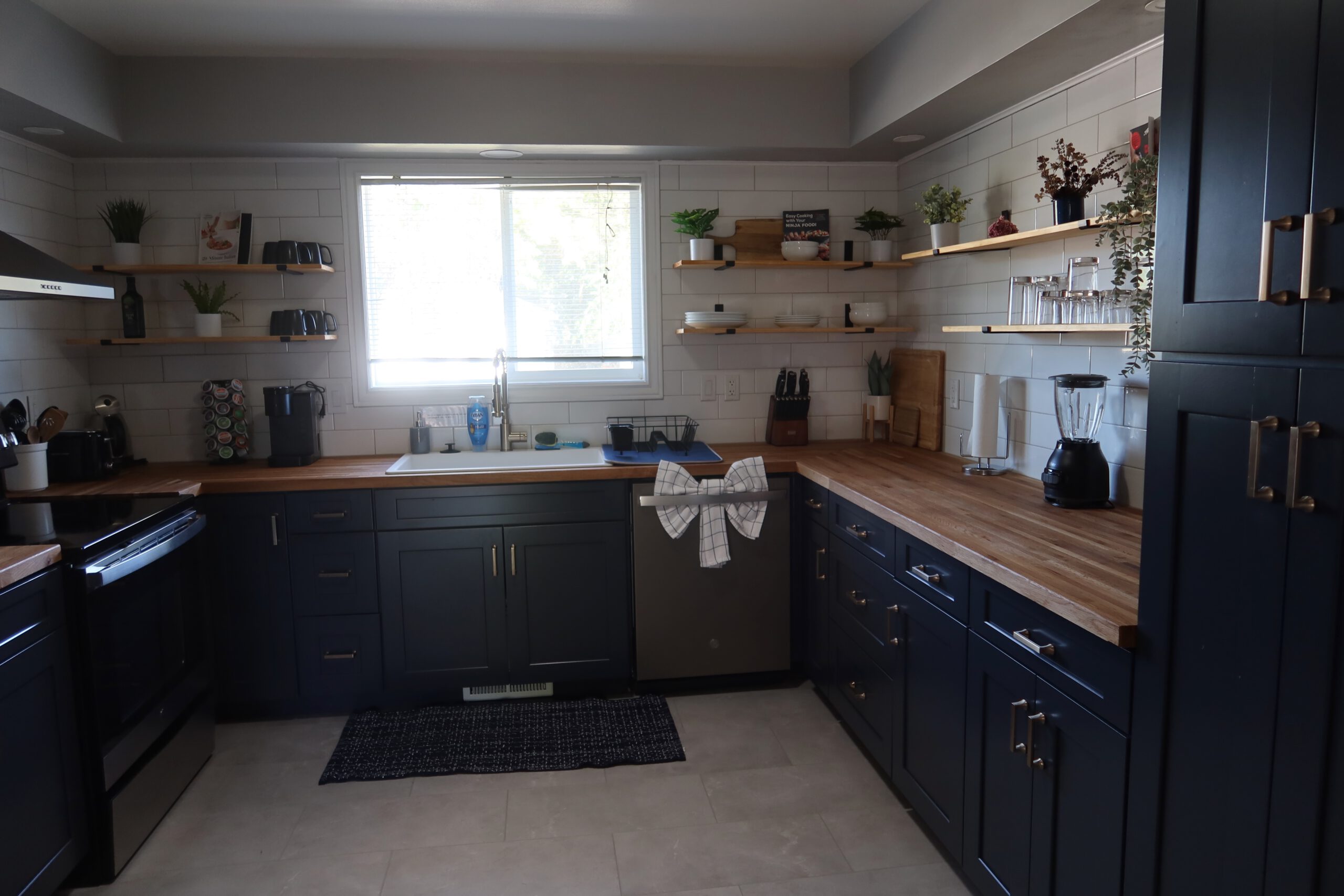 Airbnb Boise kitchen with modern appliances, gas stove and spacious countertop