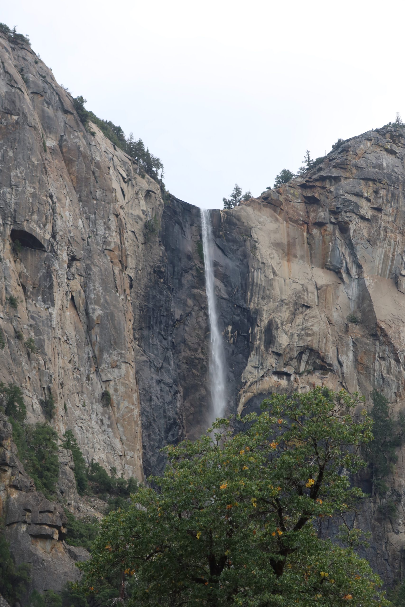 Yosemite National Park waterfall cascading down granite cliffs in Yosemite Valley