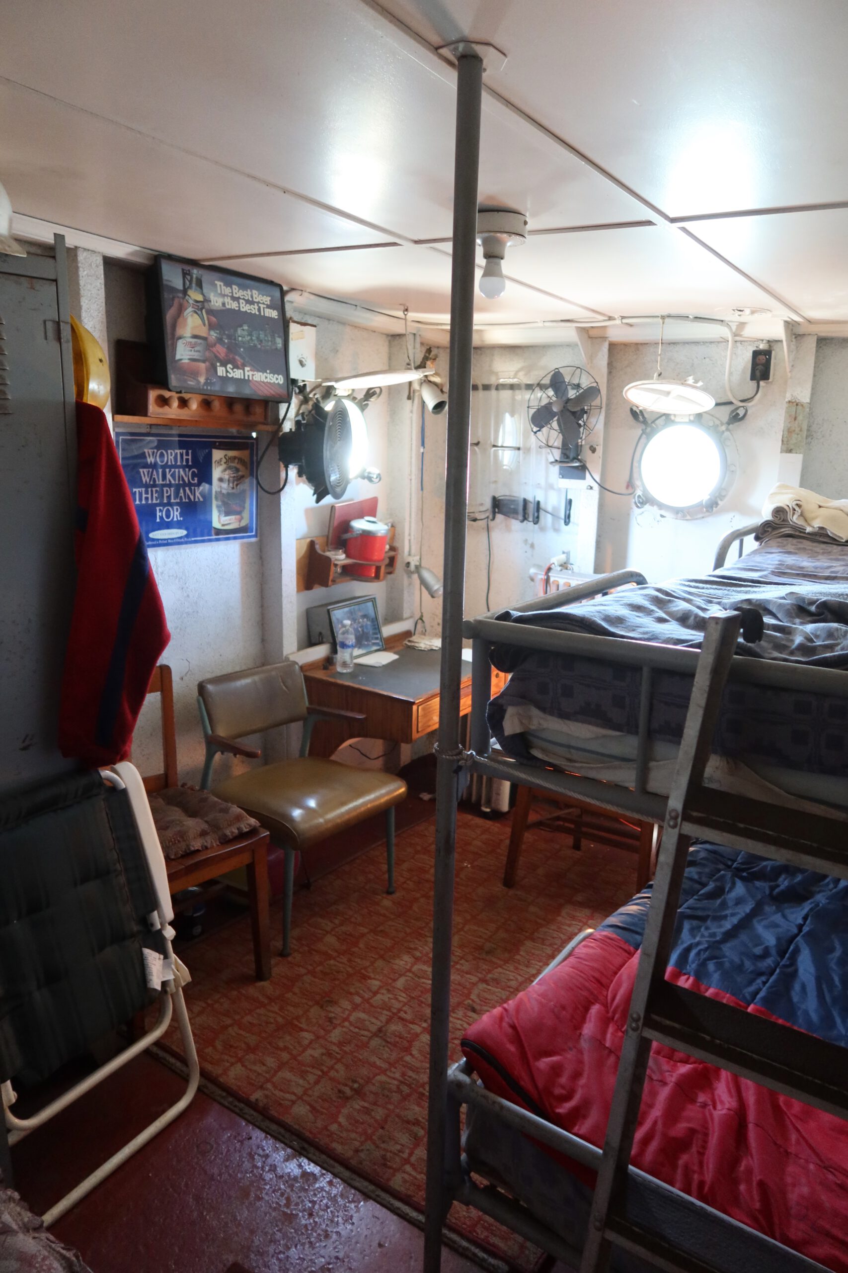 SS Jeremiah O'Brien crew sleeping quarters showing narrow bunk beds and original furnishings inside the World War II Liberty ship in San Francisco