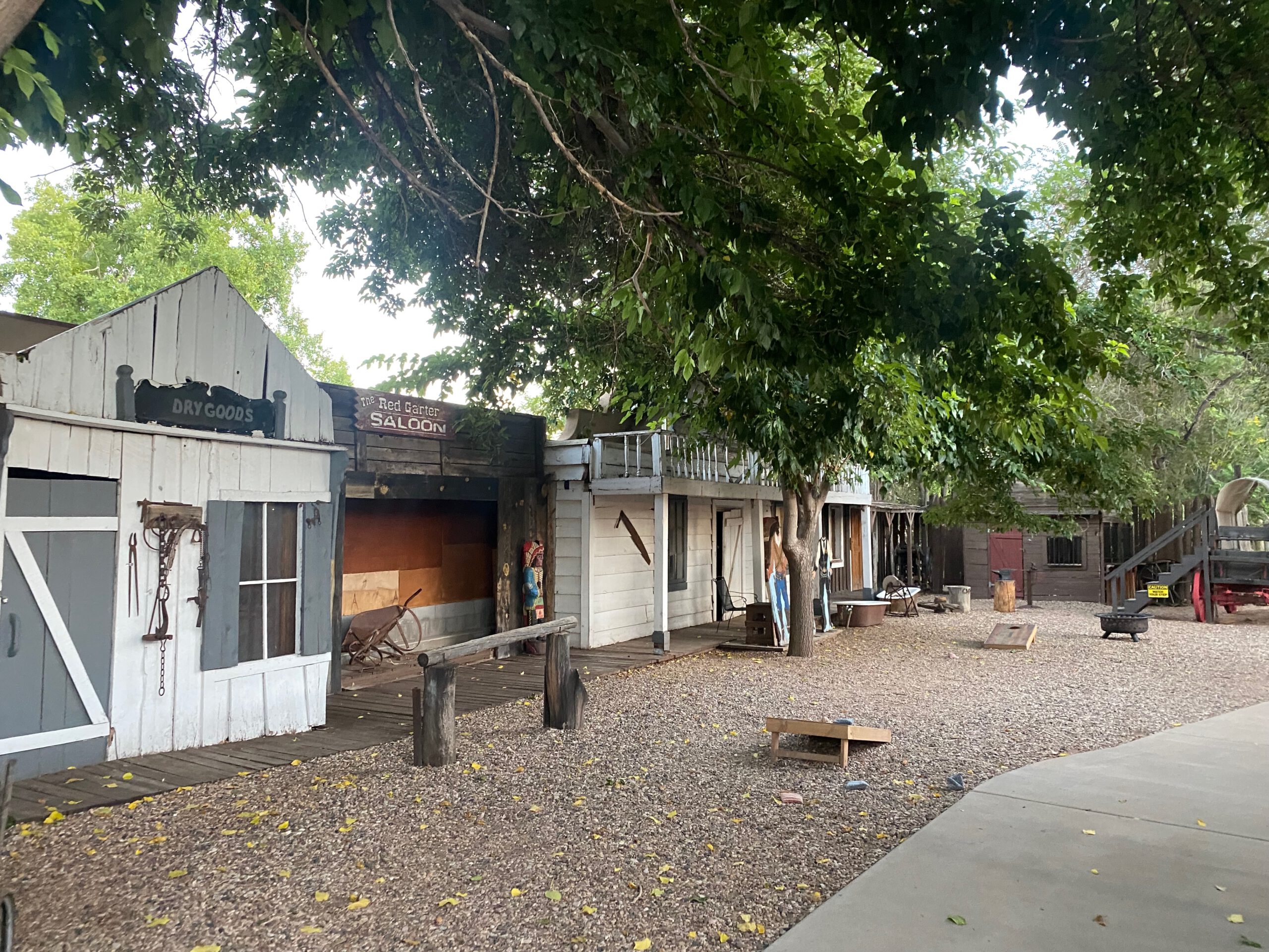 Old western style outdoor area at Iron Horse Restaurant in Kanab, Utah, featuring historic wooden buildings and a relaxed atmosphere