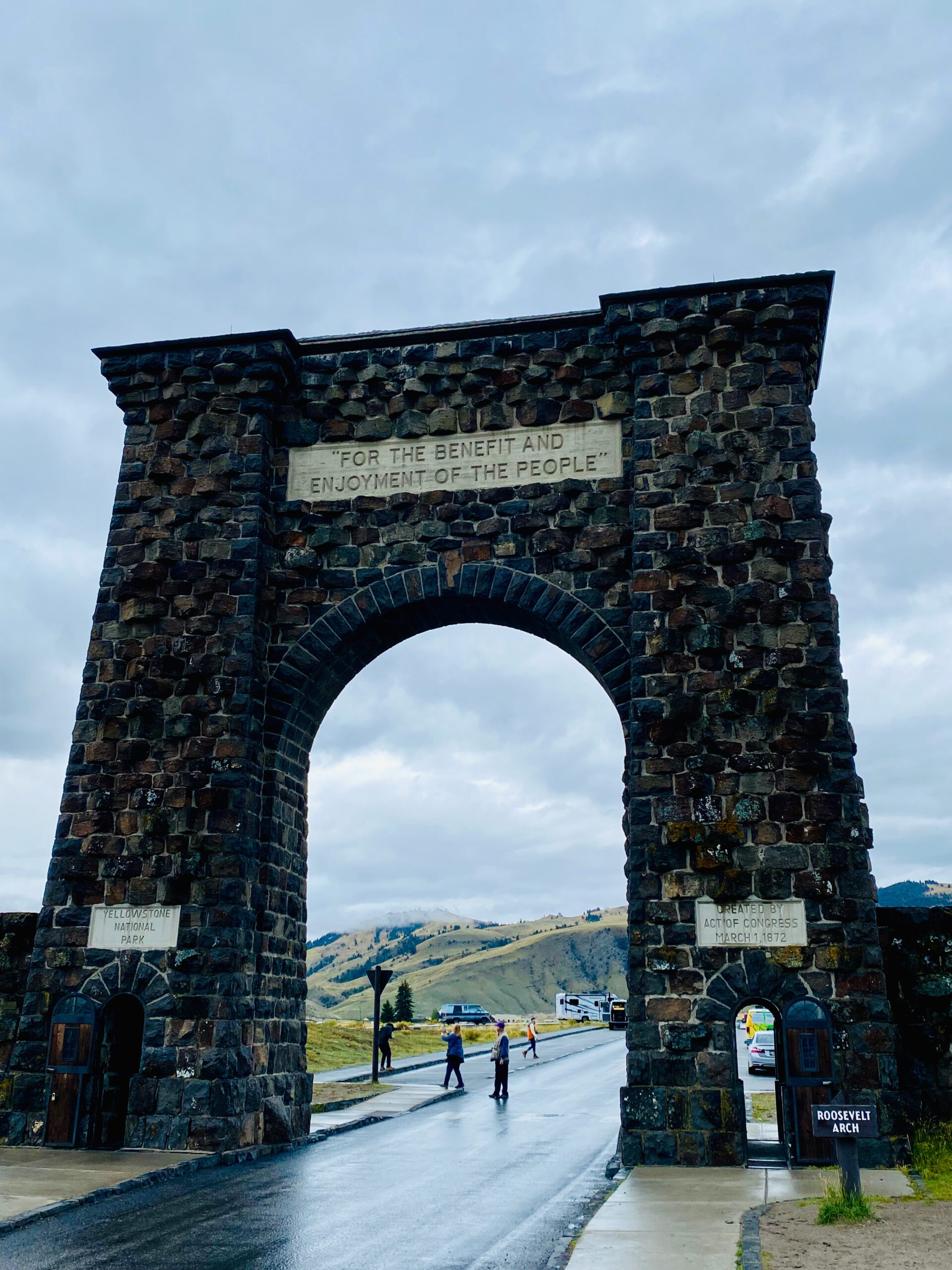 Roosevelt Arch Yellowstone with the inscription “For the Benefit and Enjoyment of the People”, marking the iconic North Entrance near Gardiner, Montana