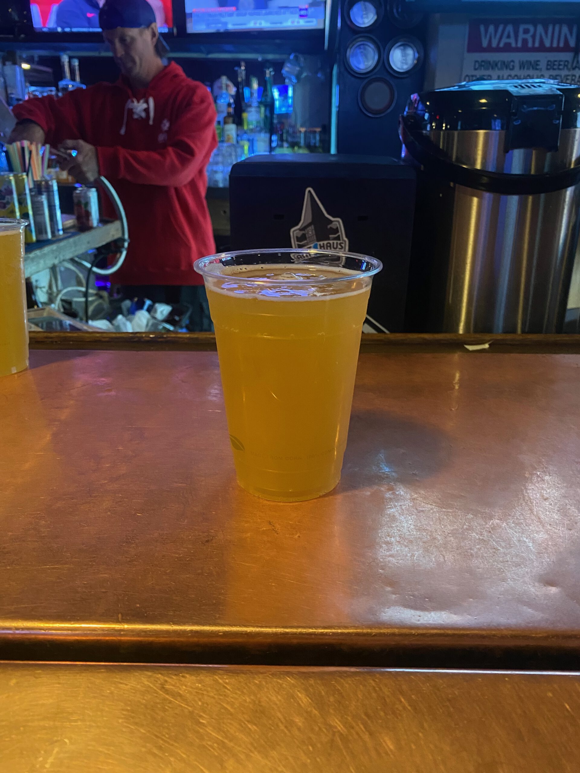 Fresh draft beer on the bar at The Grid Bar and Grill Lake Tahoe with bartender and sports bar atmosphere