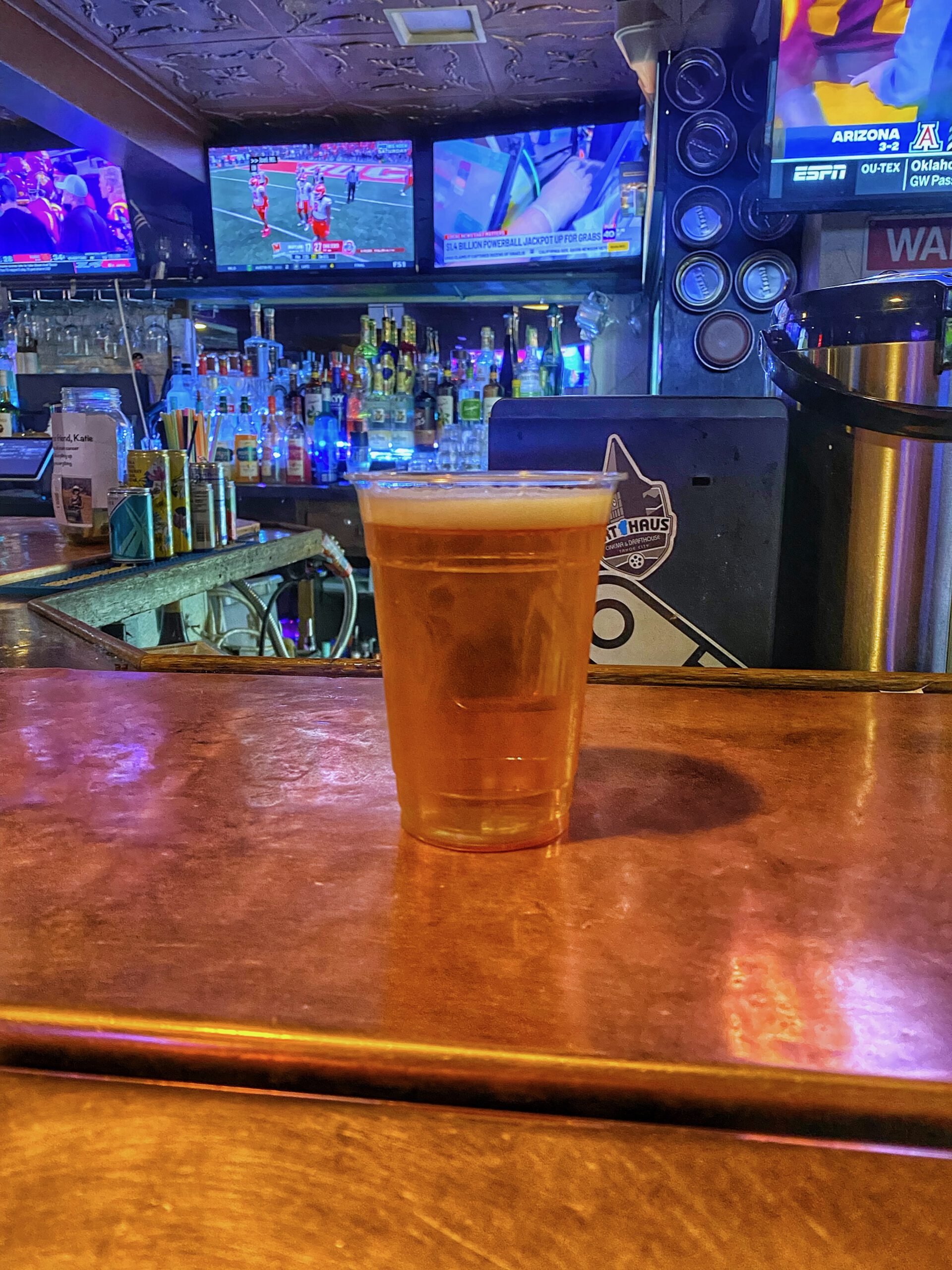 Fresh draft beer served at The Grid Bar and Grill Lake Tahoe with sports screens and classic bar interior