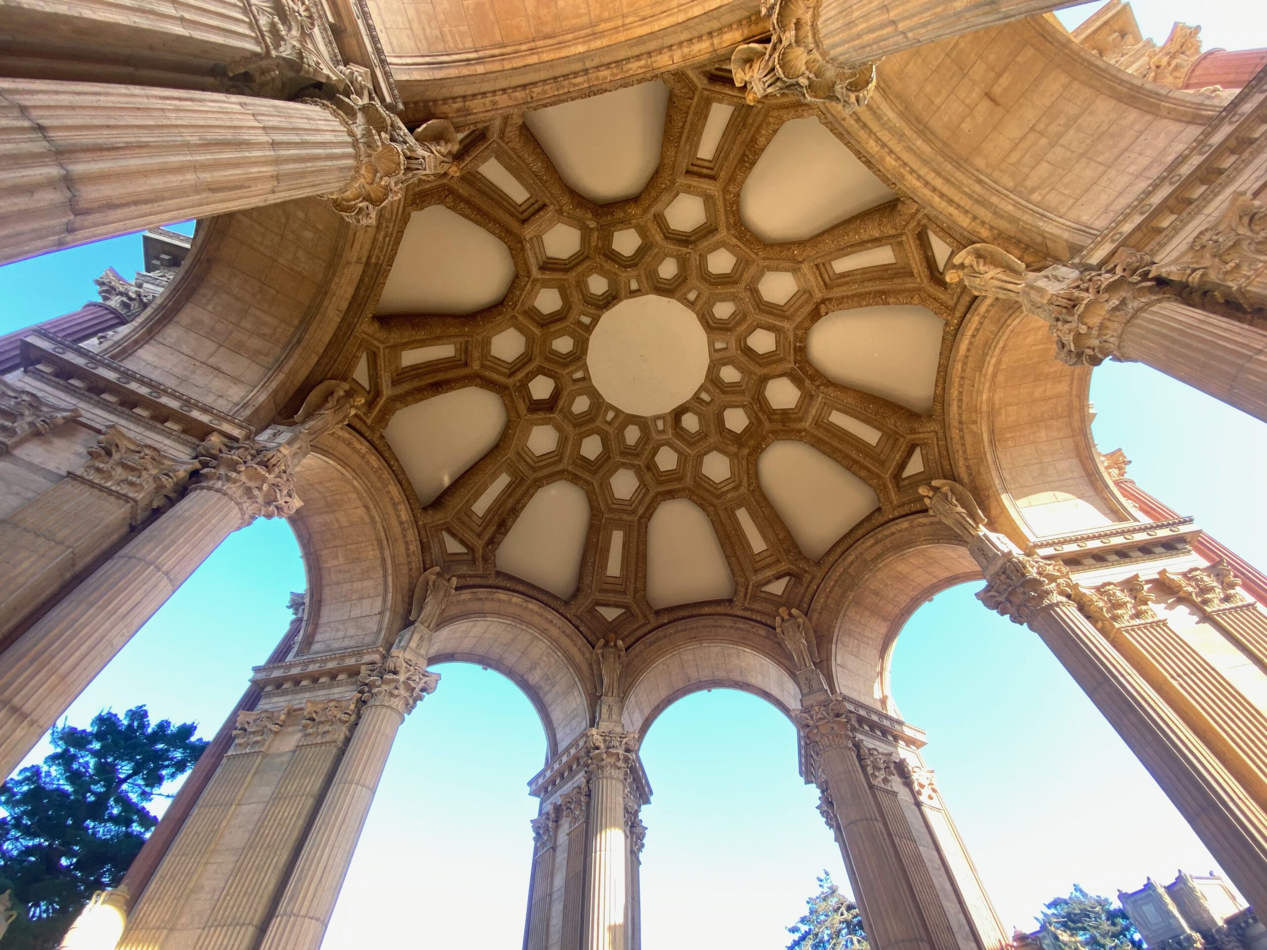 Palace of Fine Arts San Francisco rotunda ceiling viewed from below, highlighting the geometric coffered dome, arches, and detailed classical architecture